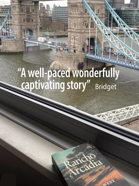 View of Tower Bridge over the River Thames in London with a book titled 'Rancho Arcadia' resting on a windowsill and a quote on the image that reads, 'A well-paced wonderfully captivating story' by Bridget.