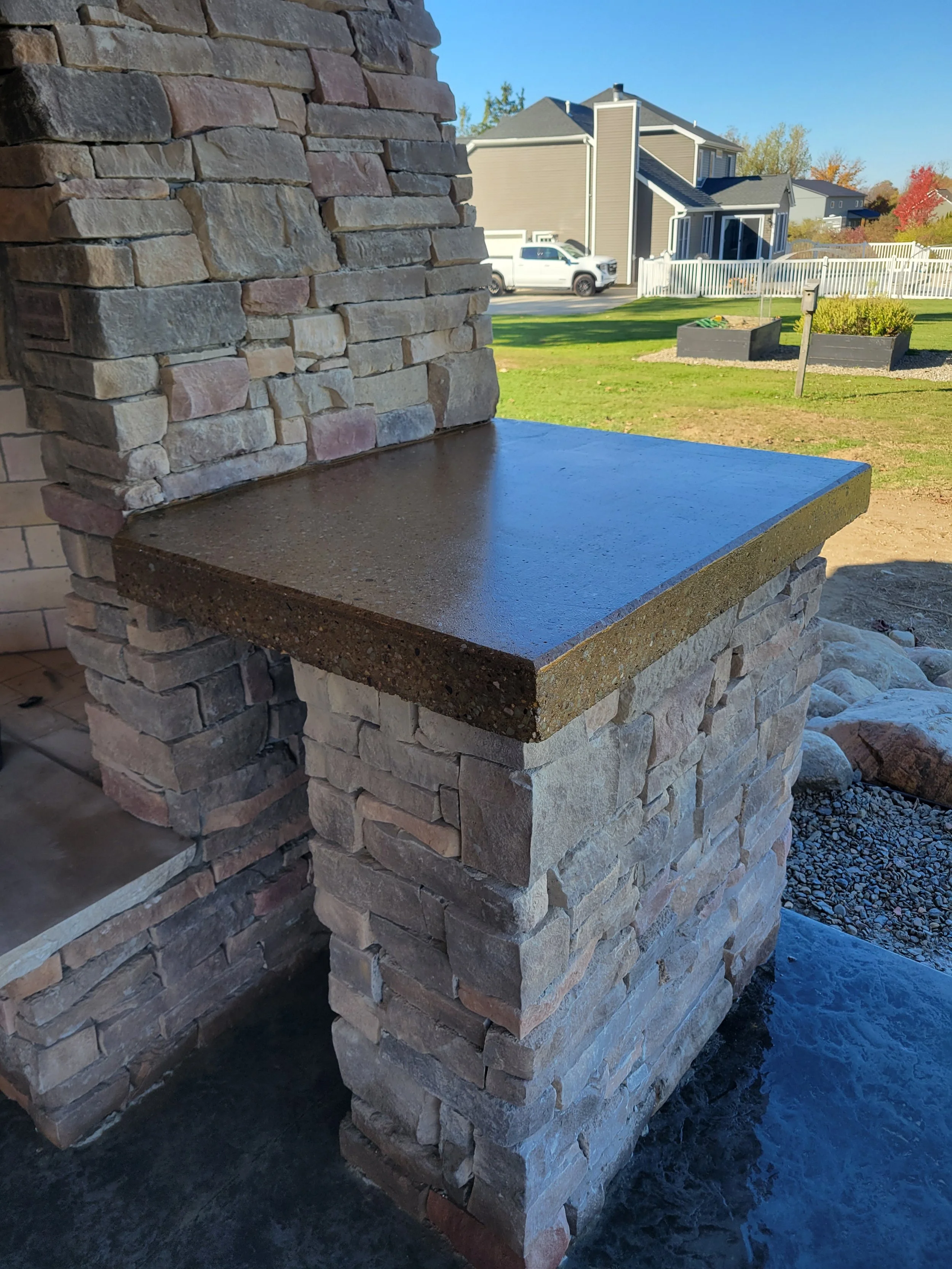 Outdoor Fireplace concrete counter top in Collins, NY.