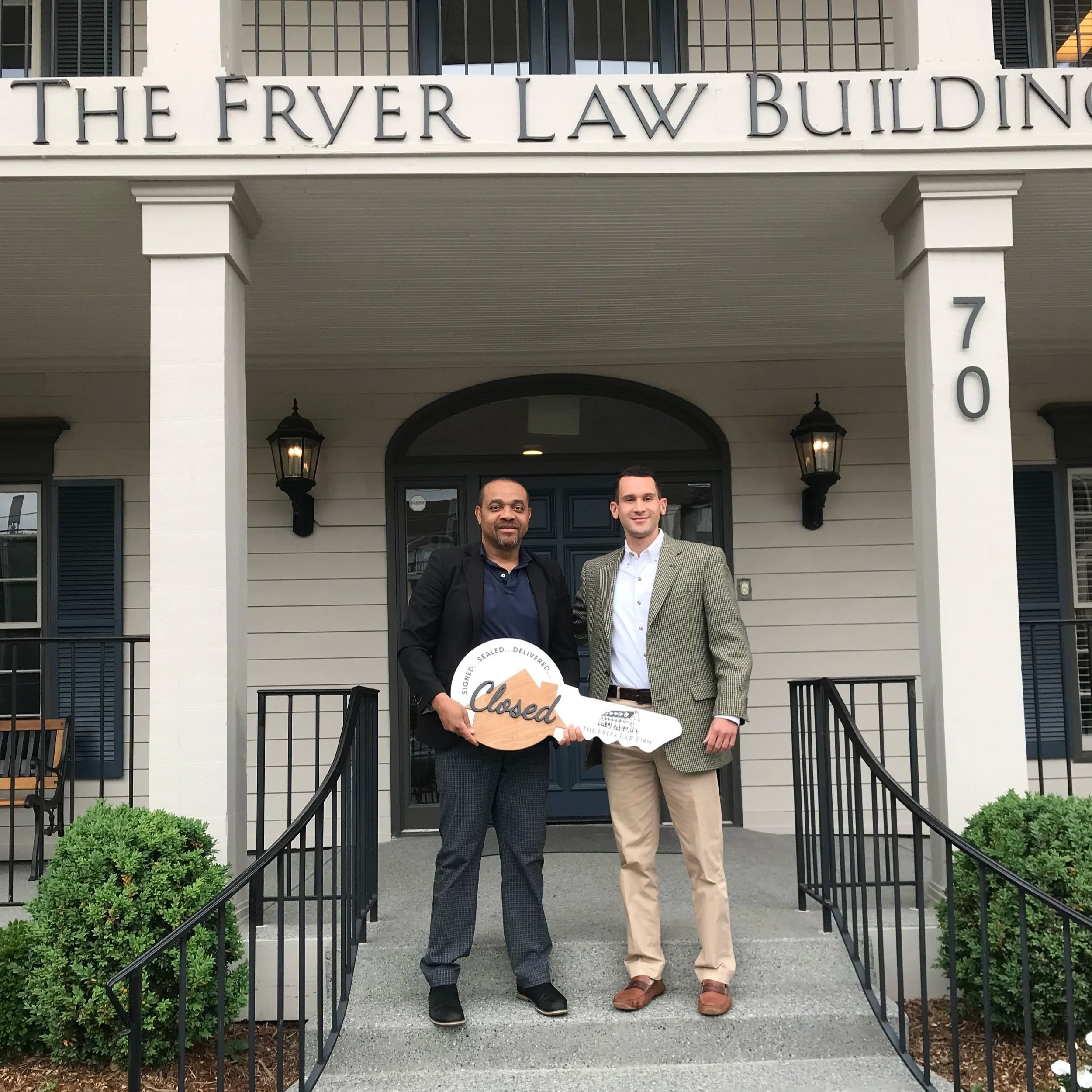 Atlanta real estate agent Cameran Jaques with client celebrating a closing