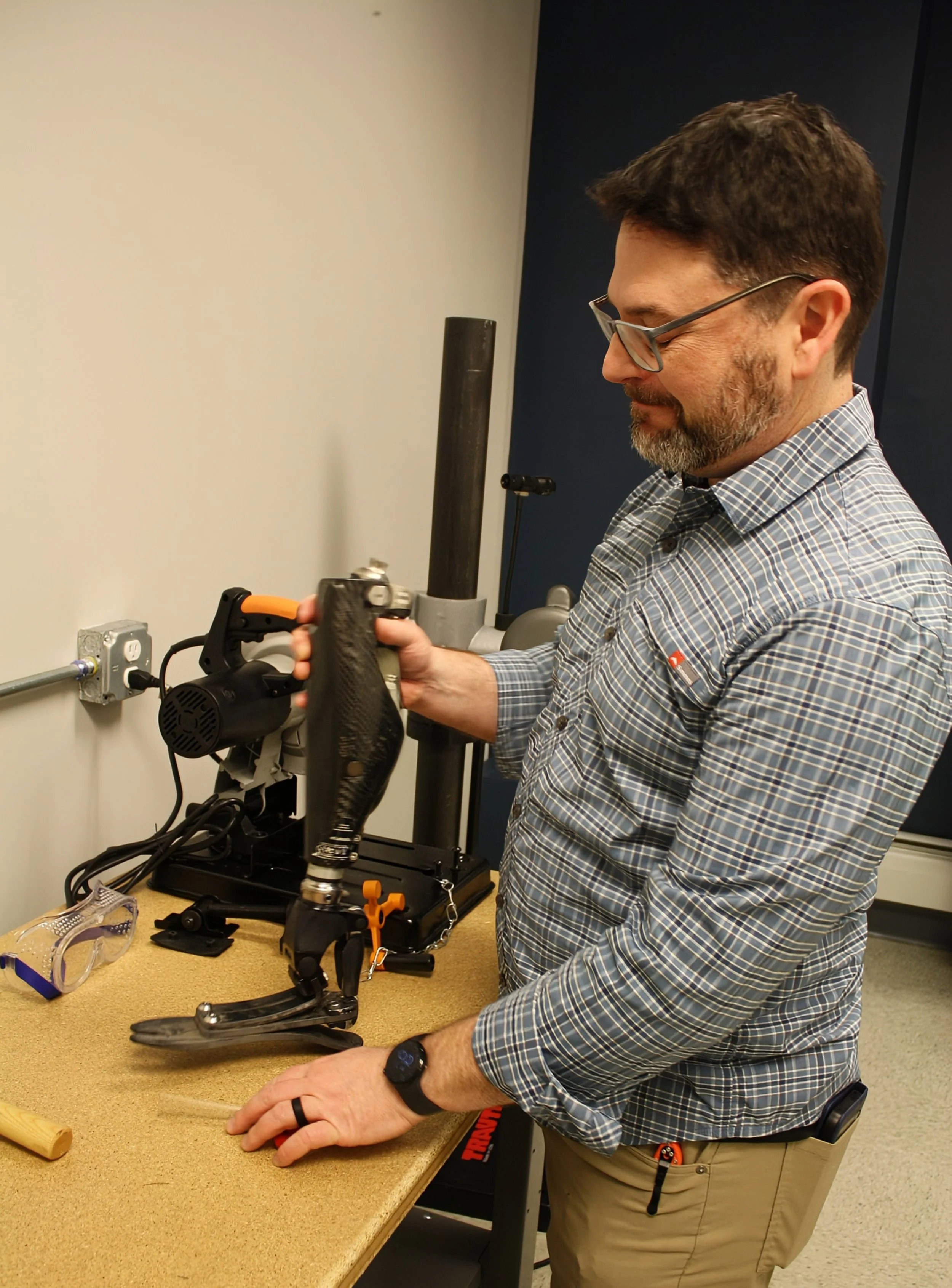 John Warren certified prosthetist is working on an artificial leg at Warre Prosthetic Labs