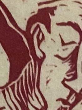 Close-up of a stylized illustration of a smiling person with short hair, wearing striped clothing.