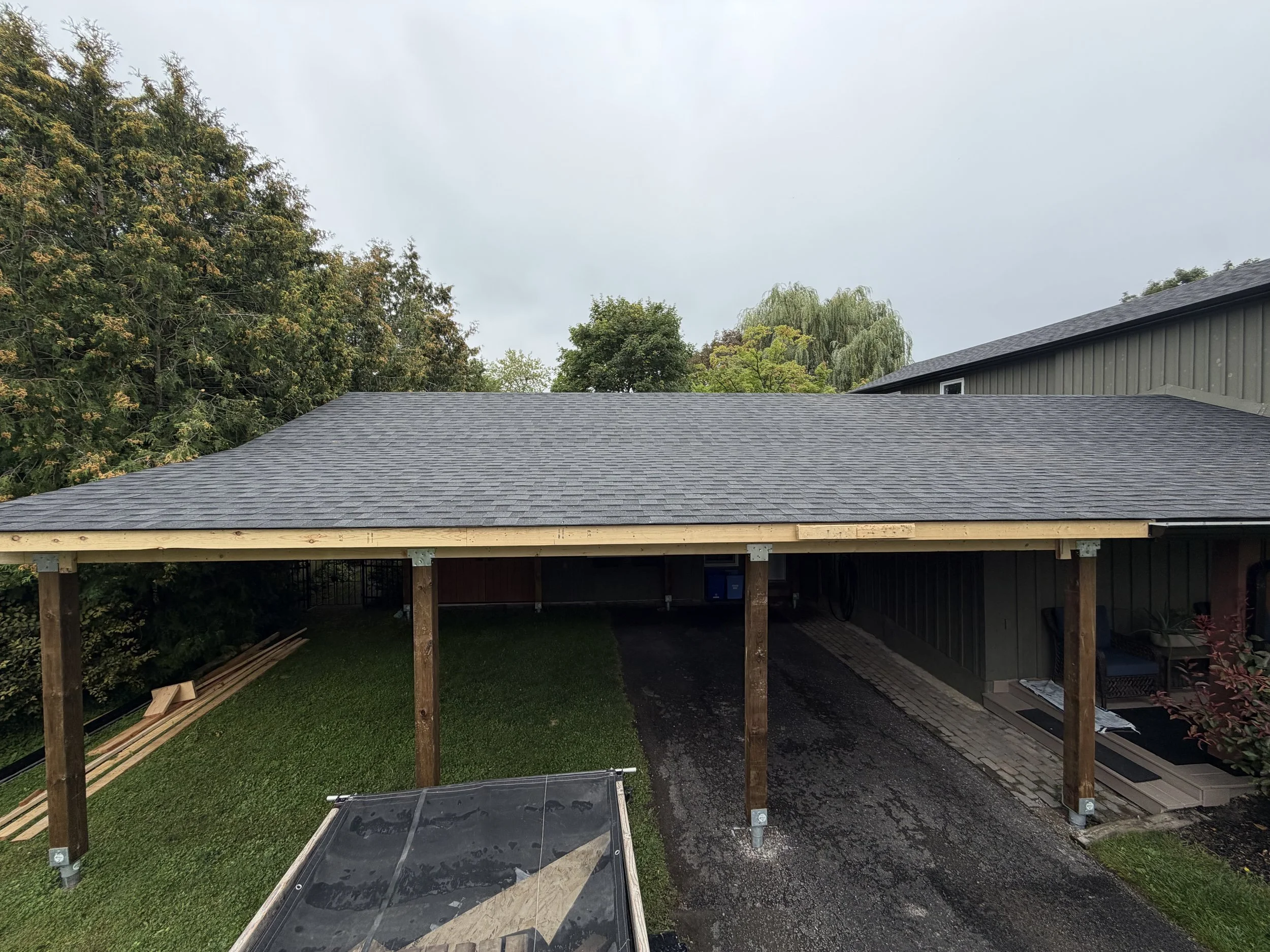 Framing and shingling completed on this 3 bay carport in Port Perry Ontario 
