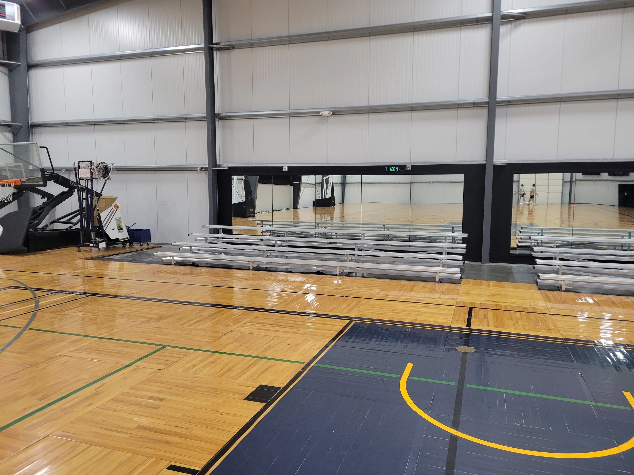 Portable sports event seating inside a gym by Bleachers NW