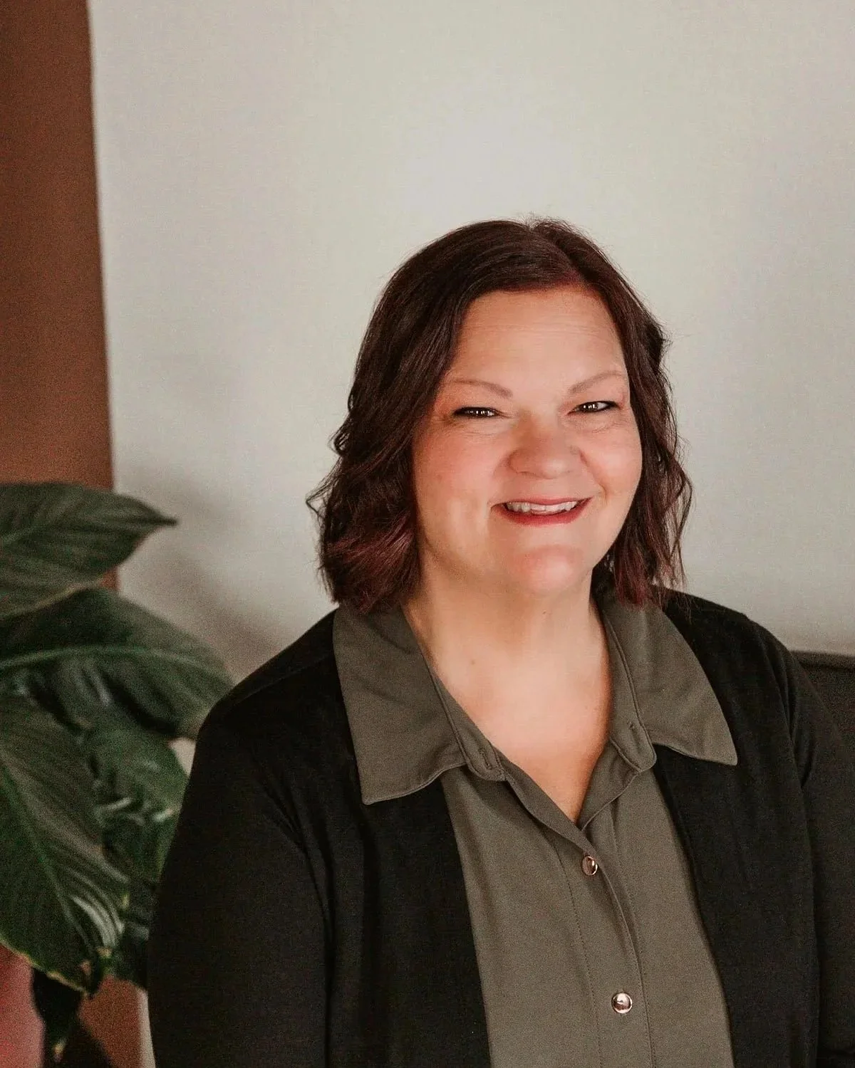 Katie McGowan, Founder and Principal of KMG Revenue Cycle Solutions, seated in a professional office setting.
