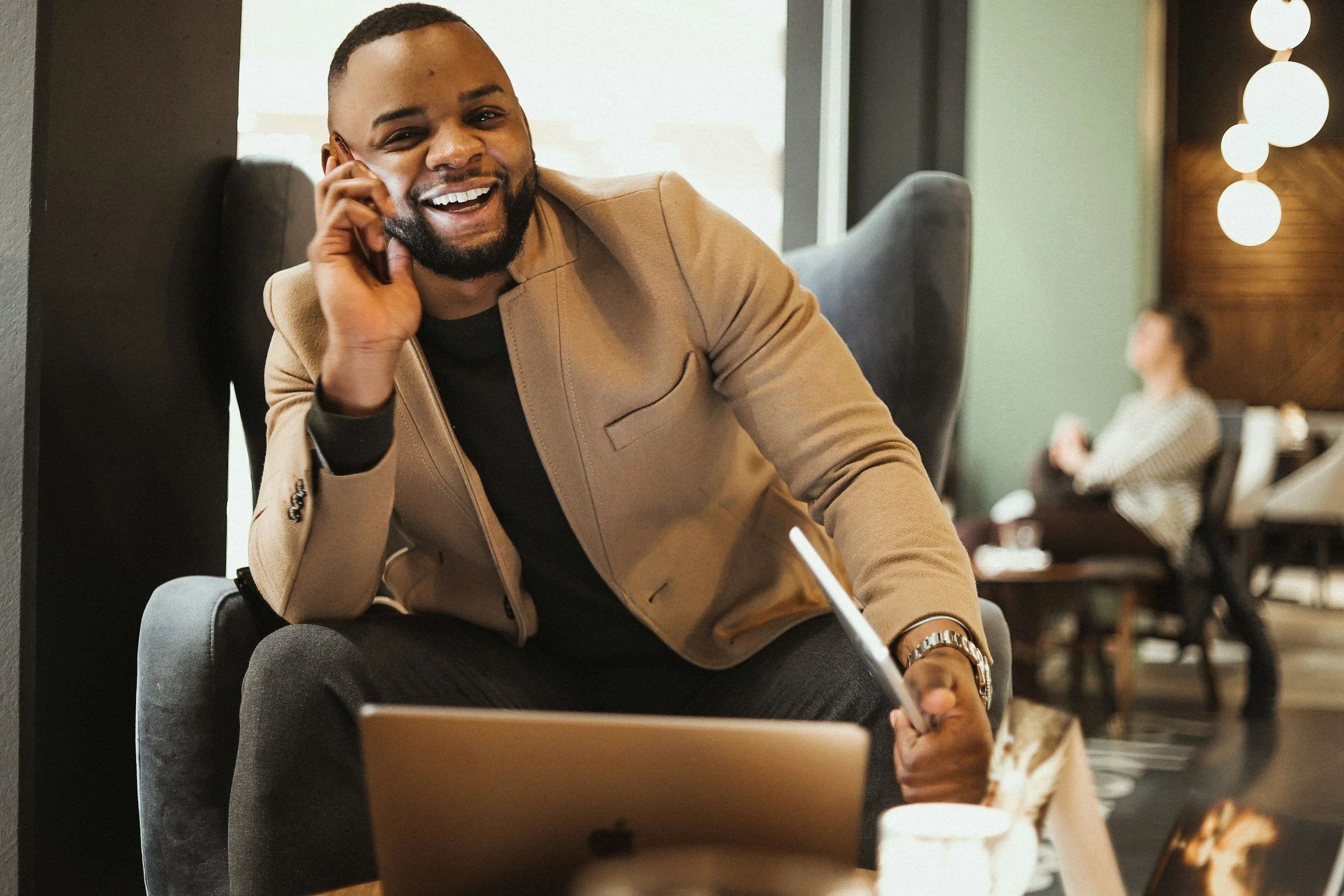Black male professional taking a phone consultation, representing EMDR therapy and trauma intensives at Healthy Mind, Healthy Heart in Atlanta