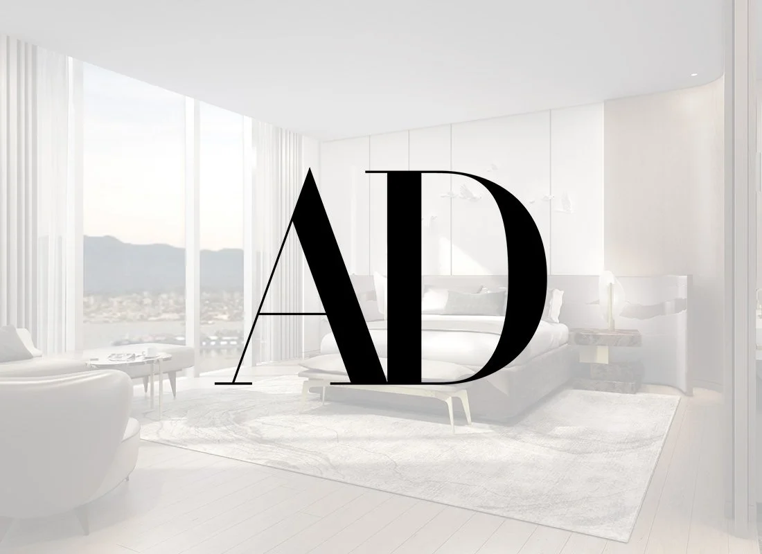 Modern bedroom with large windows, mountain view, white furniture, and decor.