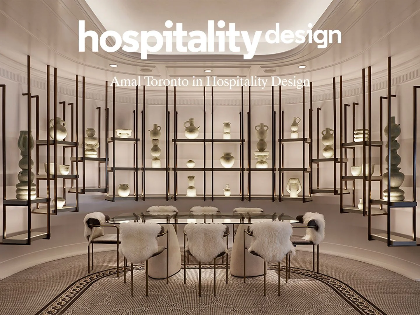 Interior of a museum or showroom with illuminated pottery displayed on black metal shelves arranged in a circular pattern; a glass table with six plush chairs with white furry covers is in the center; the ceiling features decorative molding and inset