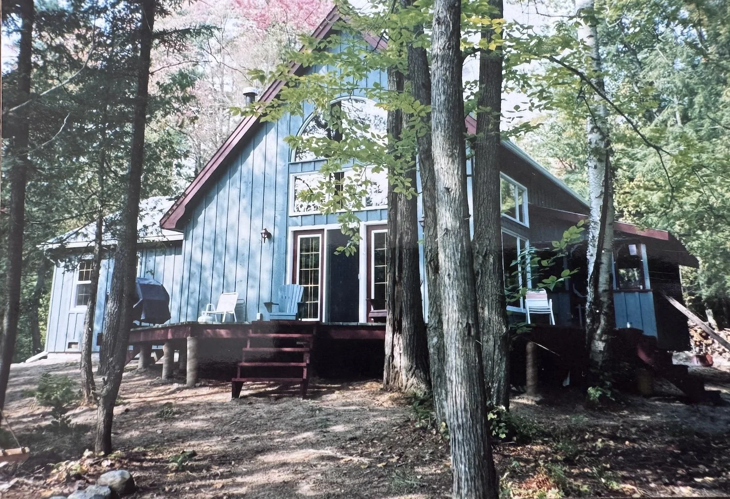 The Clarke family's first Muskoka cottage on the Joe River, Lake Joseph — a 1,400-square-foot Normerica post-and-beam build completed in 1991