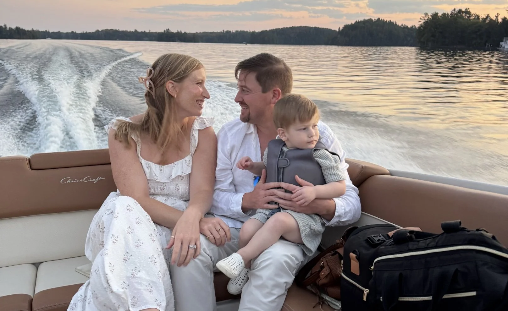 Kelcie Clarke and her family on a Chris-Craft boat at sunset on Lake Joseph, representing the next generation of the Clarke Muskoka family