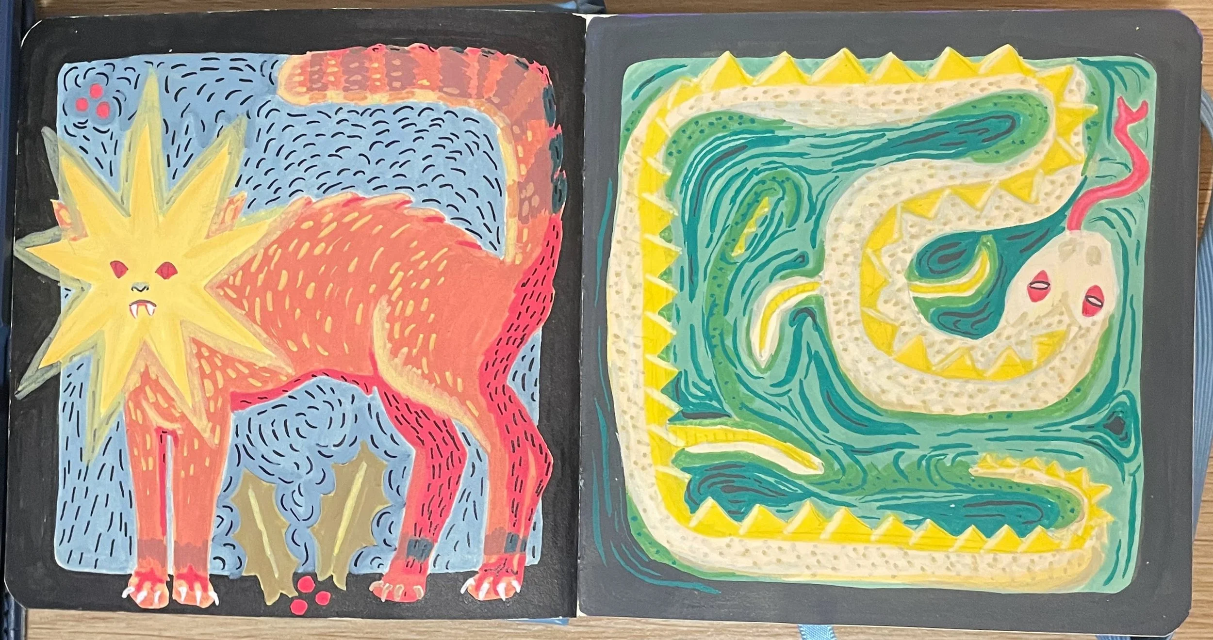 Acrylic paintings in a sketchbook.