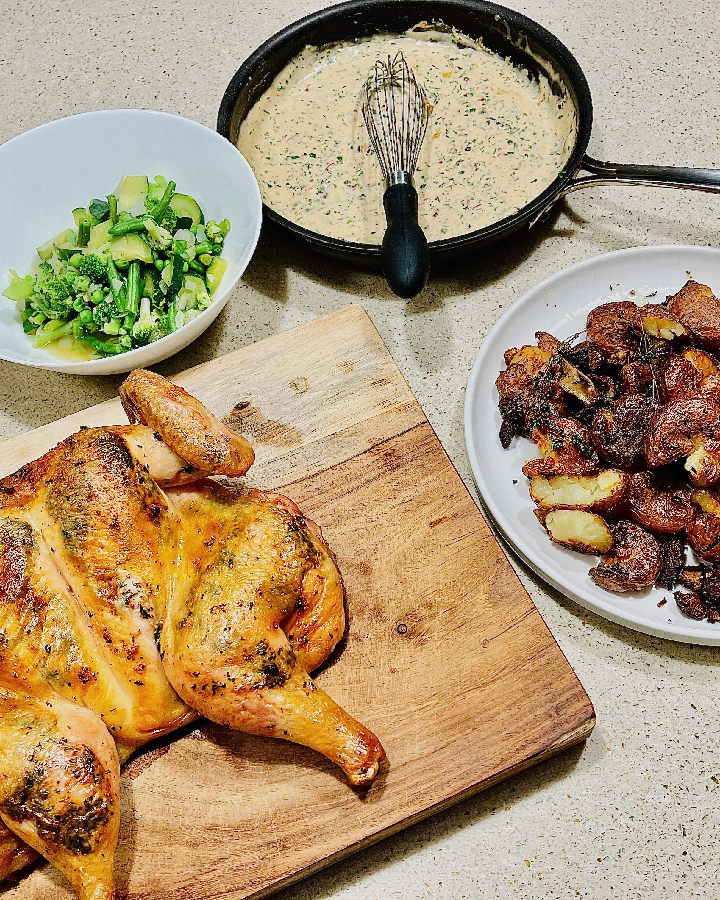 Herb spatchcock roast chicken, roast red potatoes, greens, and mustard lemon cream sauce - home cooking and food photography by Matt Kollander