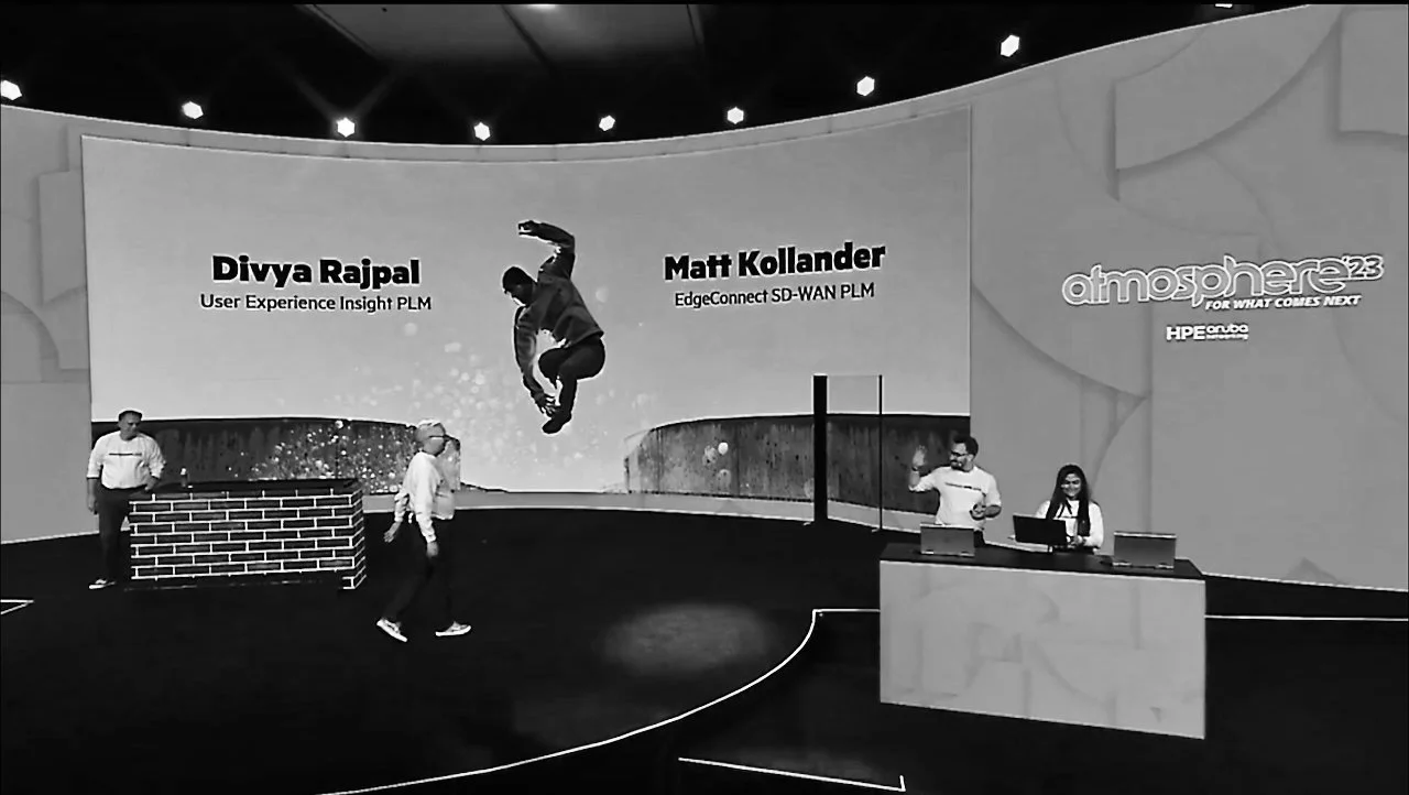 Matt Kollander on stage at a technology conference with his name displayed