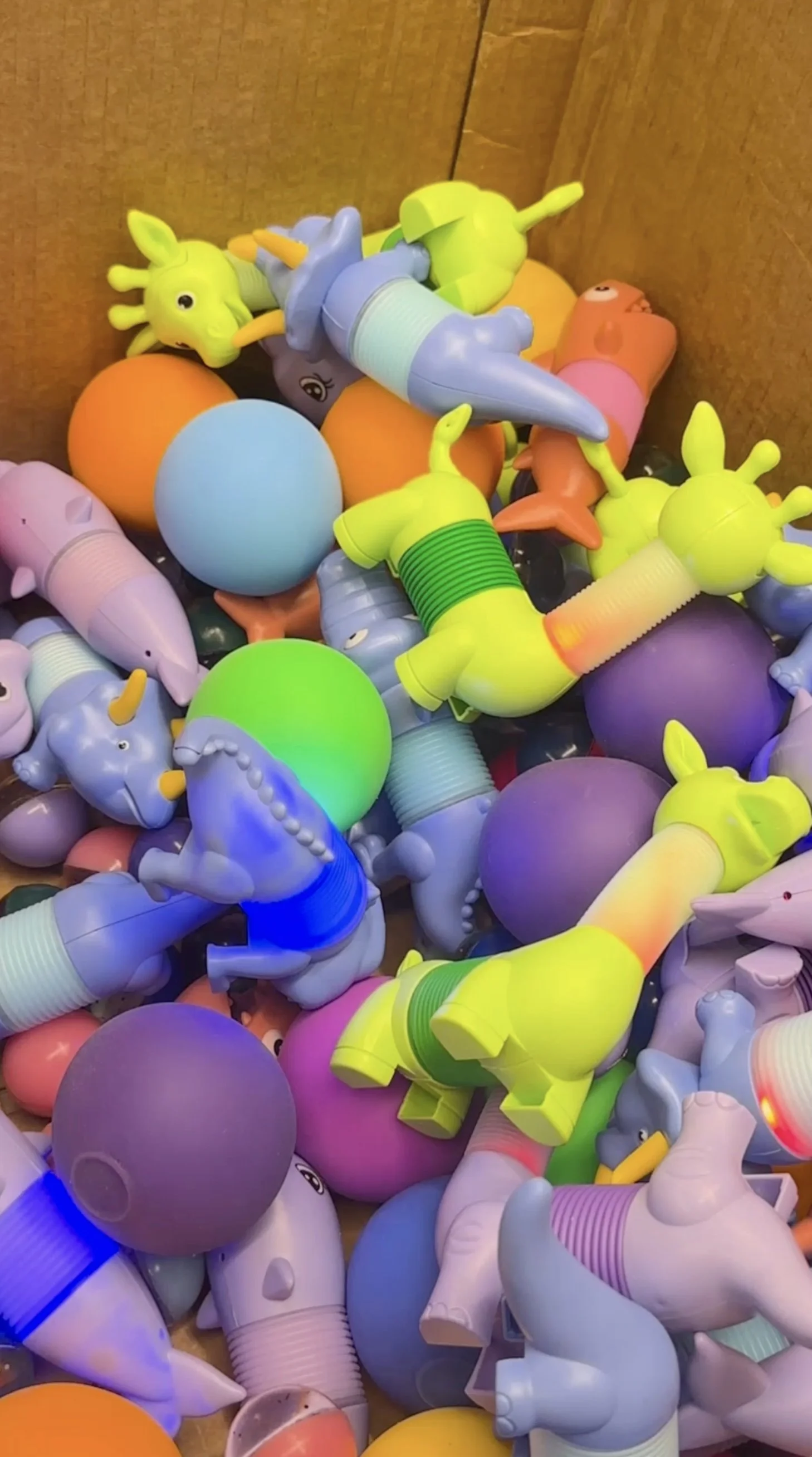 Video still of colorful toys in a box, where Matt Kollander discusses how great security starts with great design