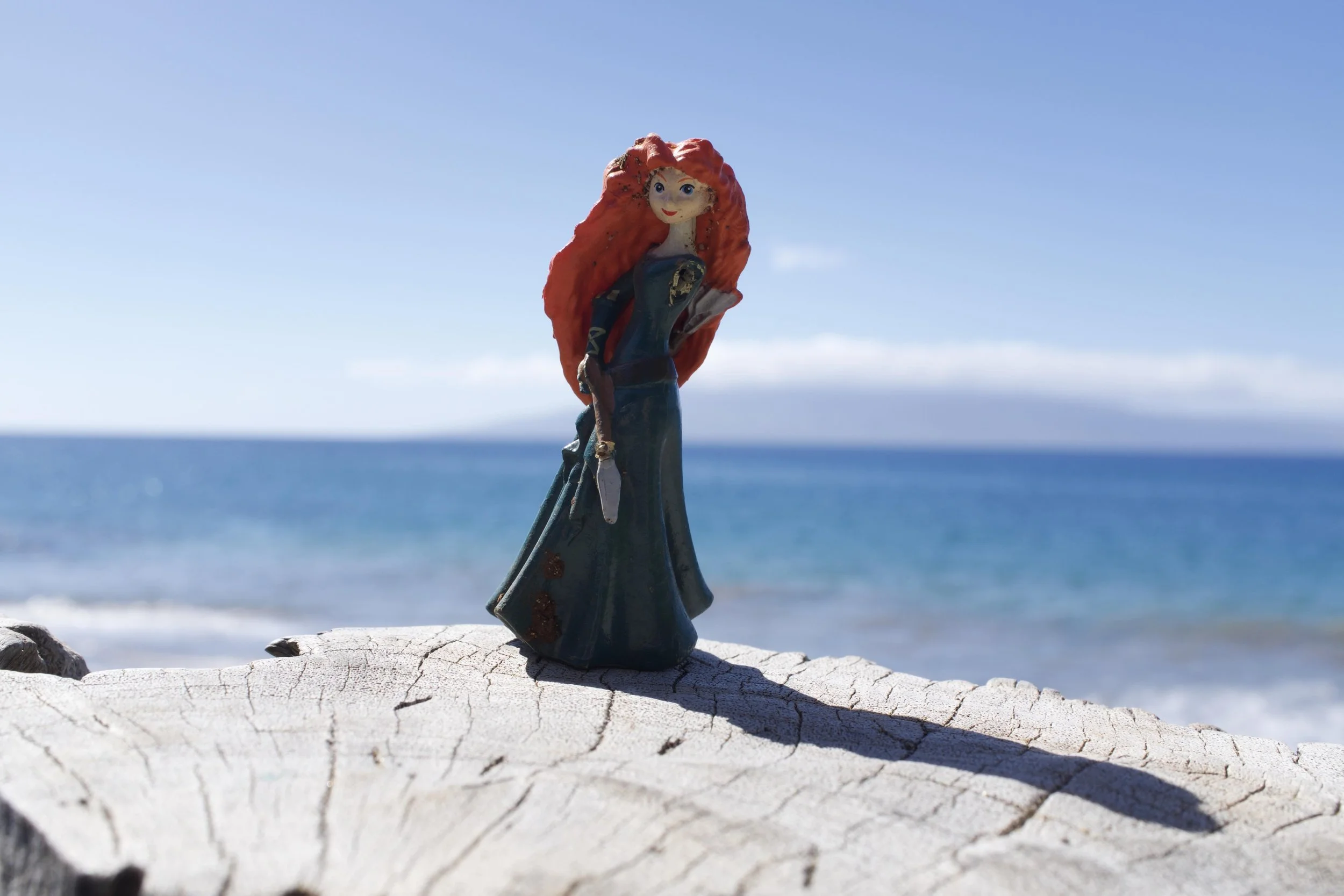 Landscape Photography by Matt Kollander - Figurine perched on the ocean