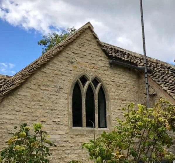 Shaped double glazing in stone mullions for a listed building