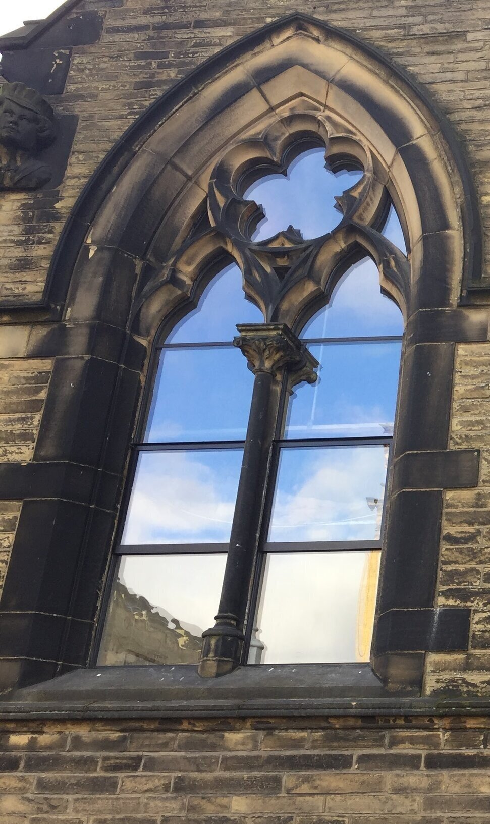 Lancet windows between stone mullions