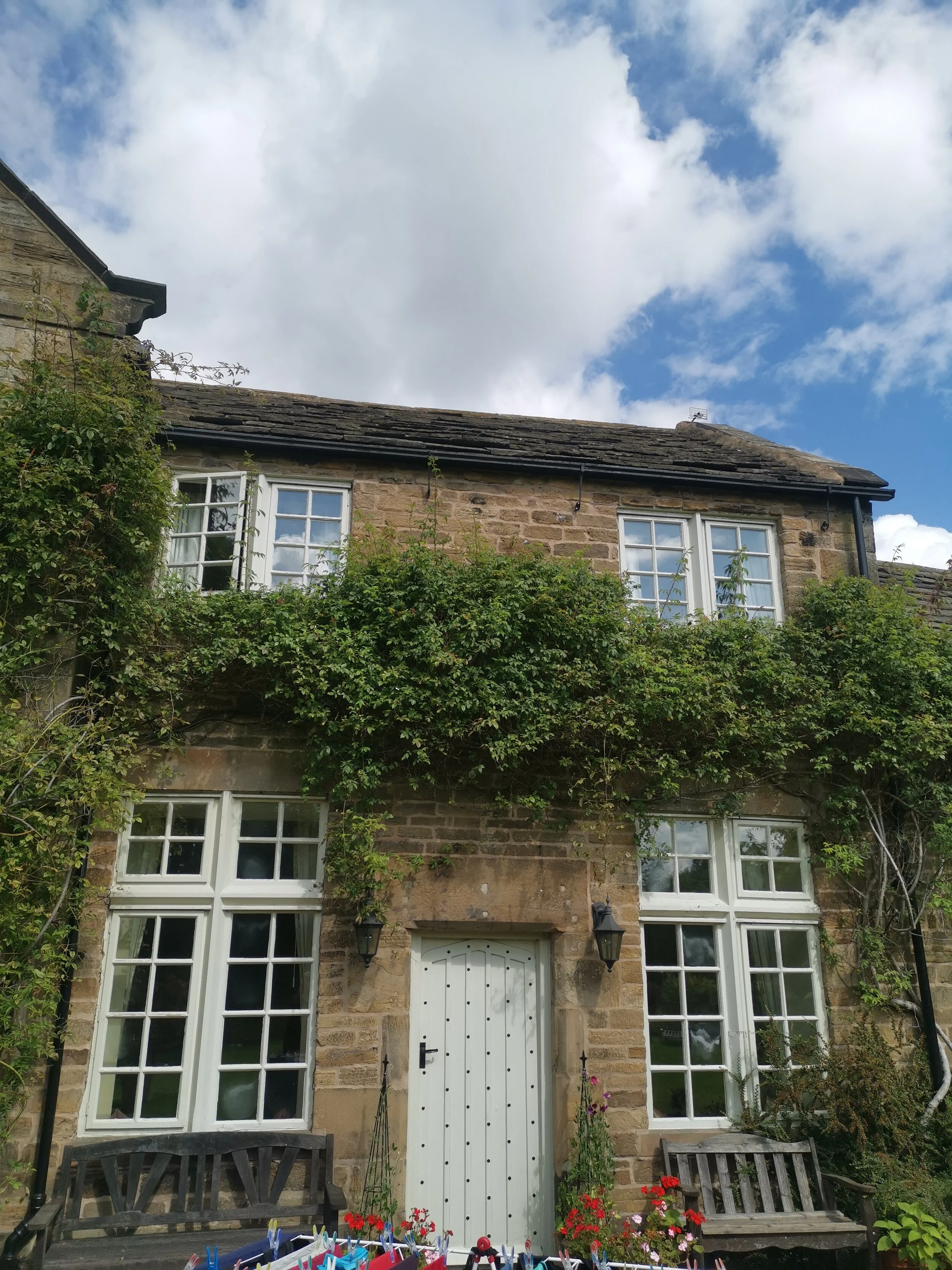 White windows set into stone mullions