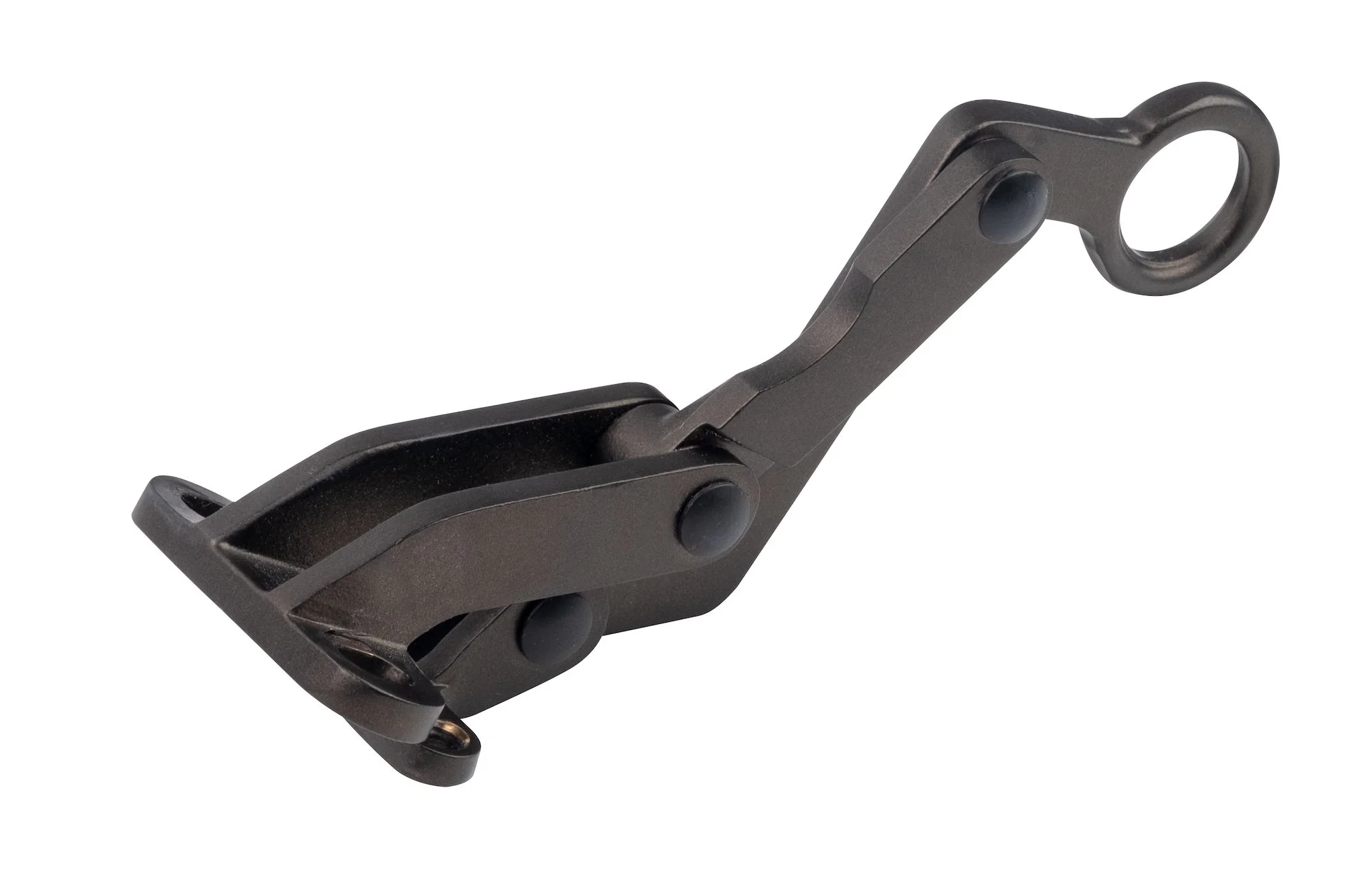 Close-up of a black firearm accessory, possibly a rail or mounting bracket, with a circular attachment point.