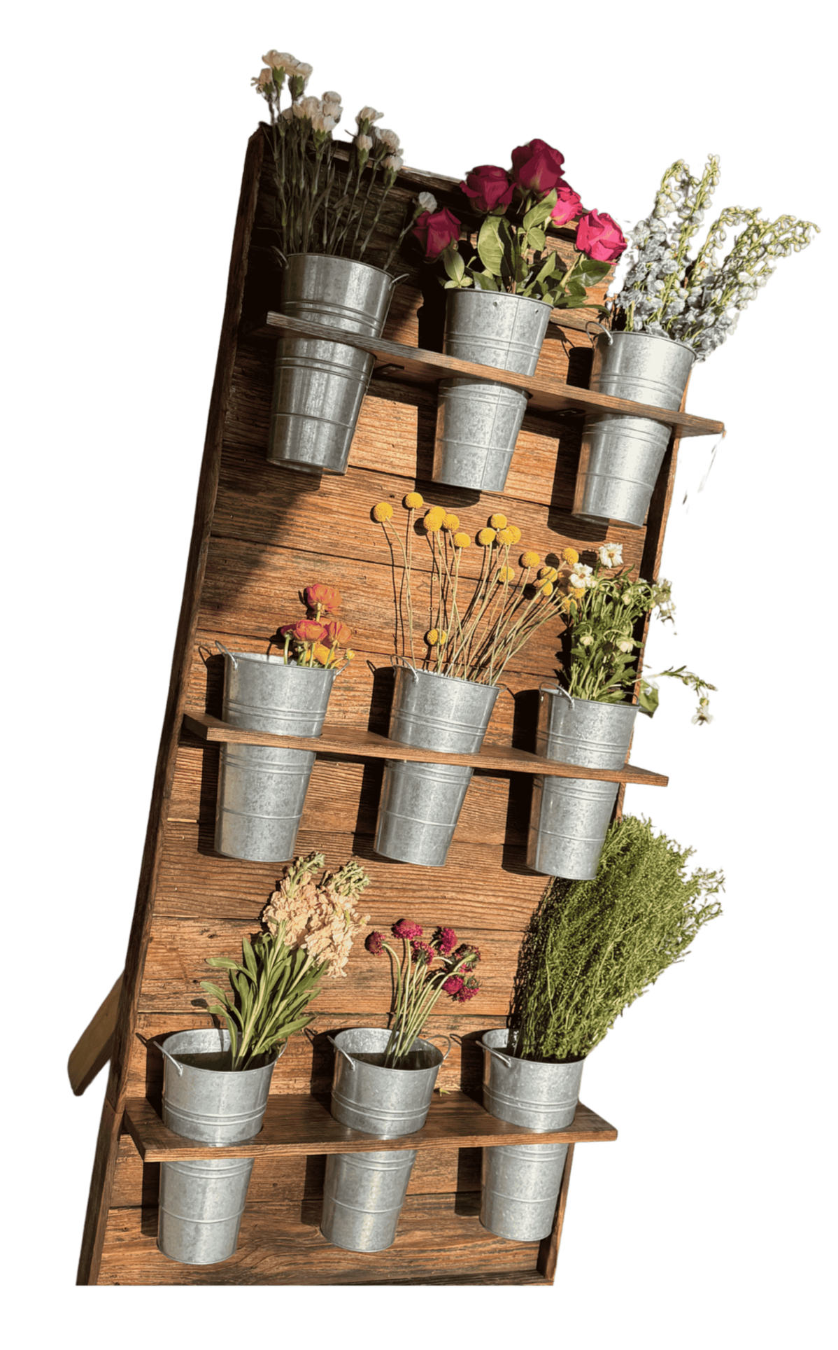 A wall of buckets holding flowers for Bouquet bar rental in Alexandria Louisiana.