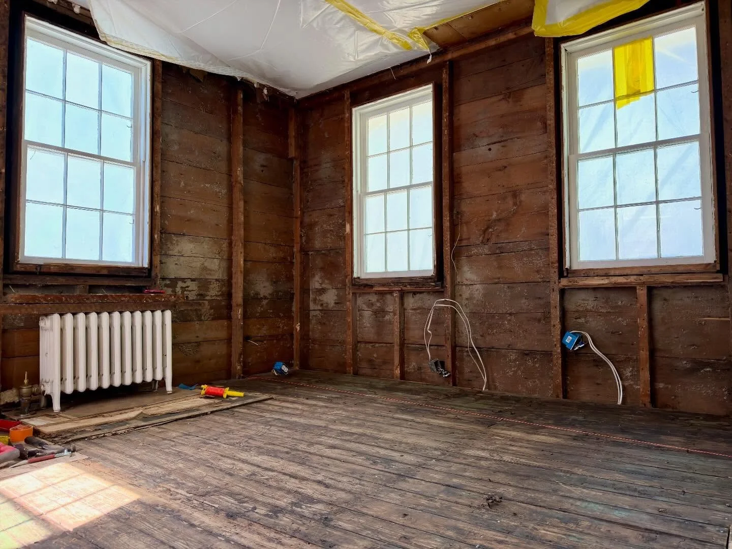 Finally got to the bottom of this floor in Wickford. 

To ensure our new floor system will be solid and secure we peeled back the layers of history; two layers of linoleum tile, Masonite, scrap material from the WW2 Naval Base in Quonset, plywood, an