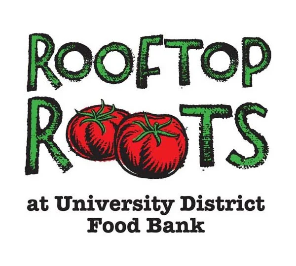 Logo for Rooftop Roots at University District Food Bank featuring the text 'Rooftop Roots' with two red tomatoes as the letter 'O's and additional text below.