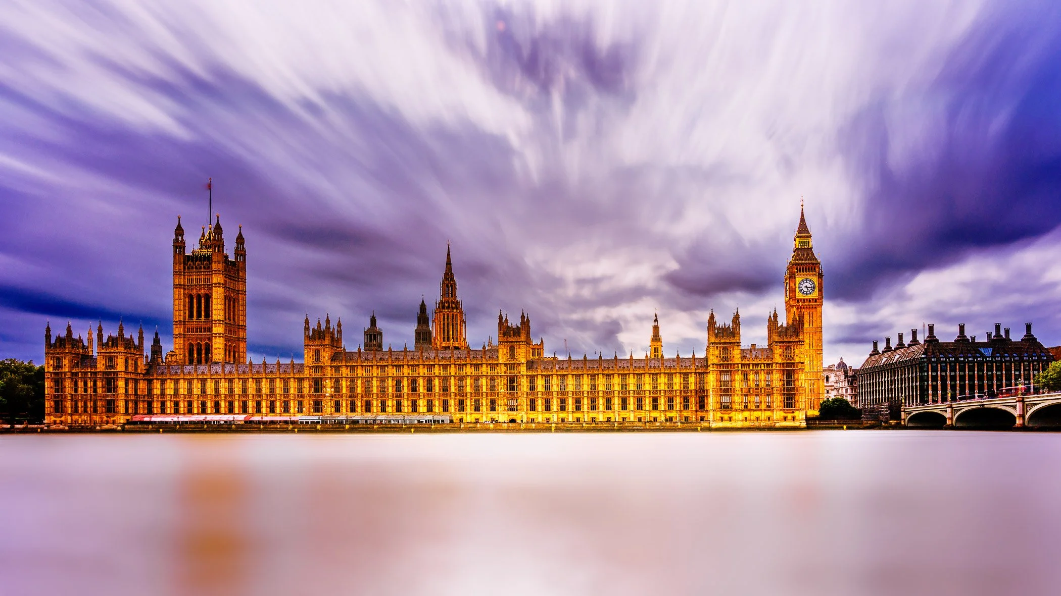 Majestic Houses of Parliament A grand view highlighting the Gothic Revival architecture and riverside presence of the Palace of Westminster.