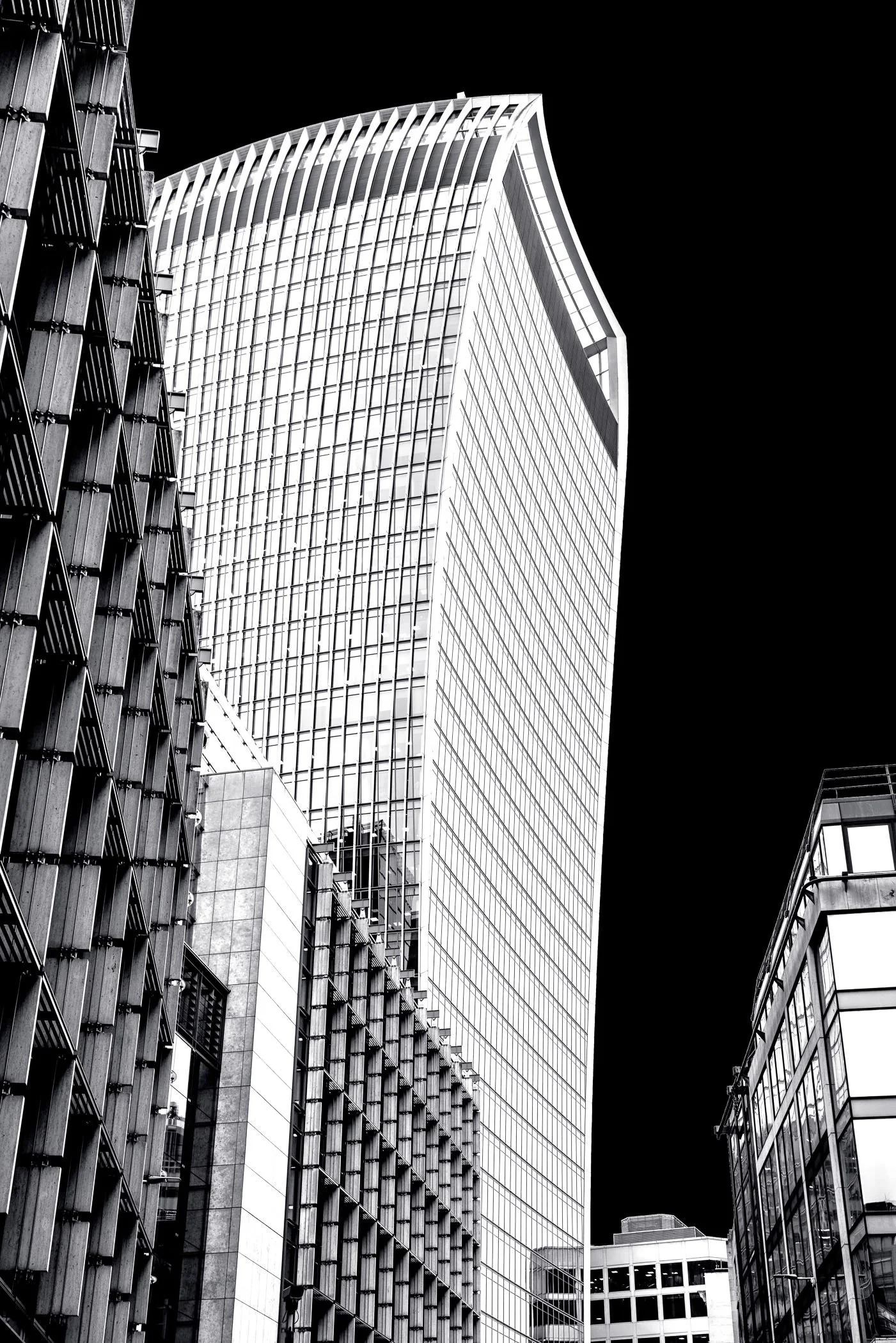Walkie-Talkie The distinct, top-heavy silhouette of 20 Fenchurch Street framed against crisp urban contrast. 
