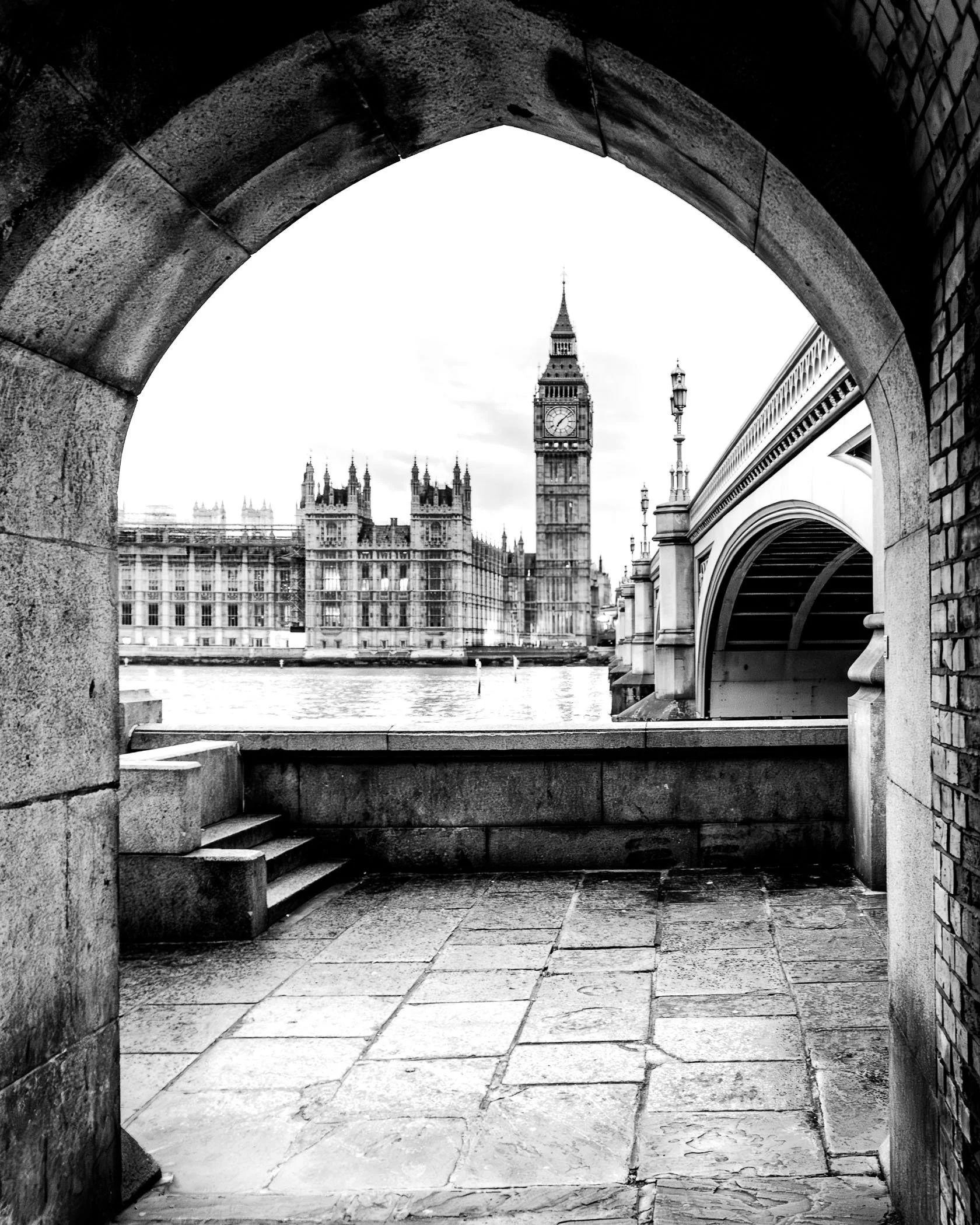 Through the Arch of Time A creative framed perspective framing historic London architecture through an ancient stone archway.