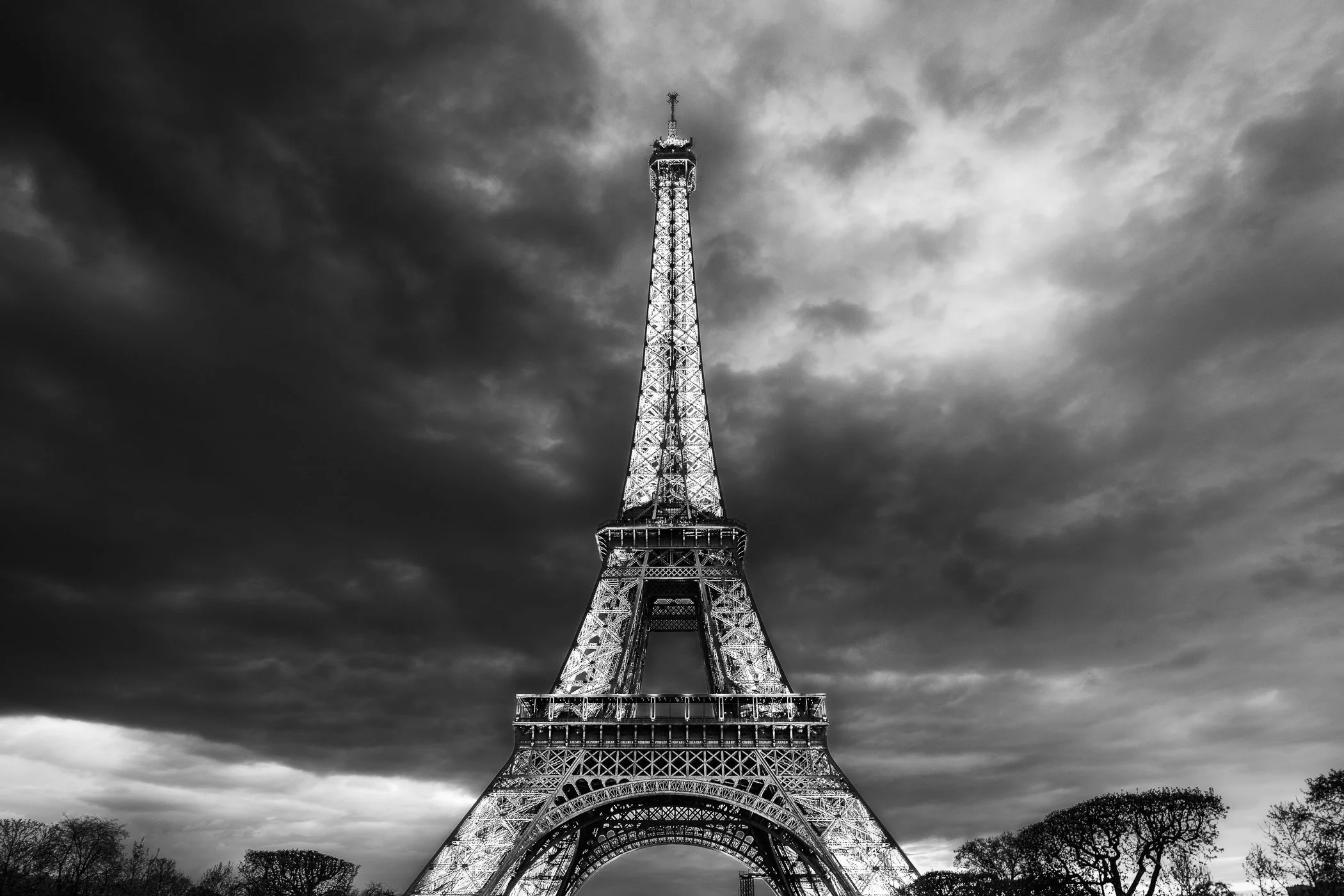Eiffel Tower A captivating view of this famous Paris landmark against a moody sky.