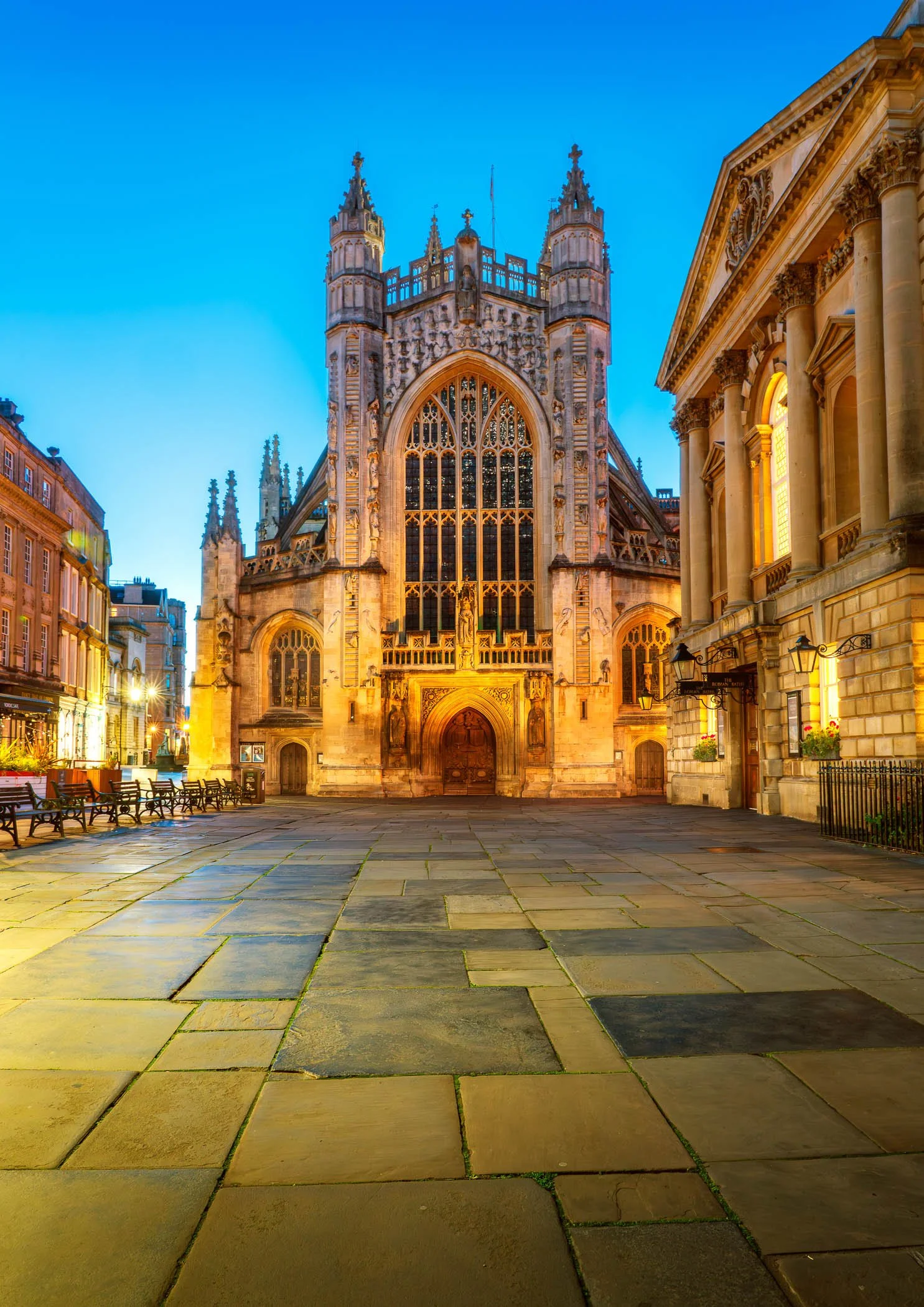 Bath Abbey in Golden Light An exterior shot capturing the grand Gothic façade of Bath Abbey bathed in warm, golden light.