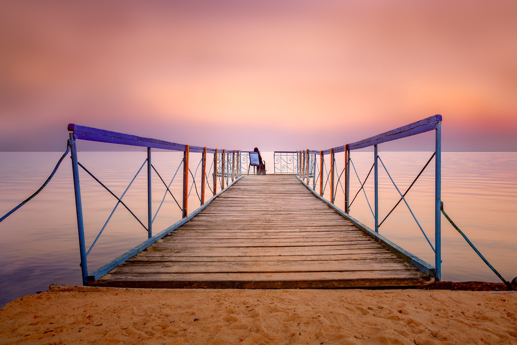 Solitude A minimalist waterscape capturing a single silhouette resting in the tranquil expanse of the Kyiv Sea.