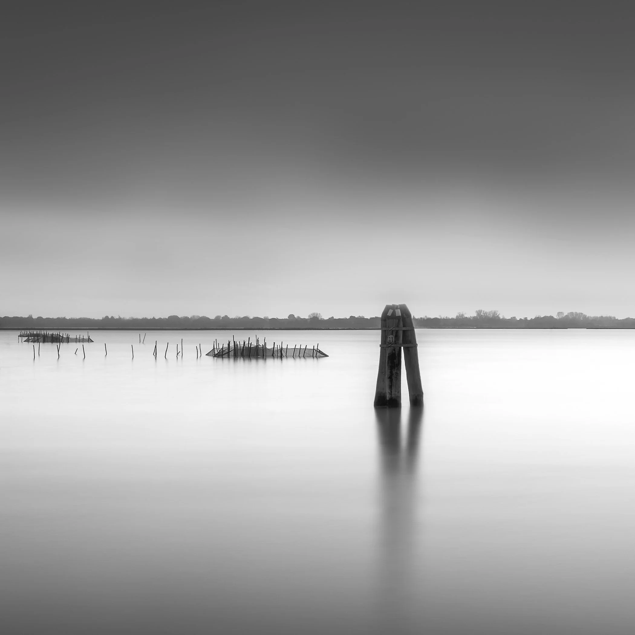 On the Lagoon A wide, calming waterscape highlighting gentle ripples and subtle horizons across the open water.