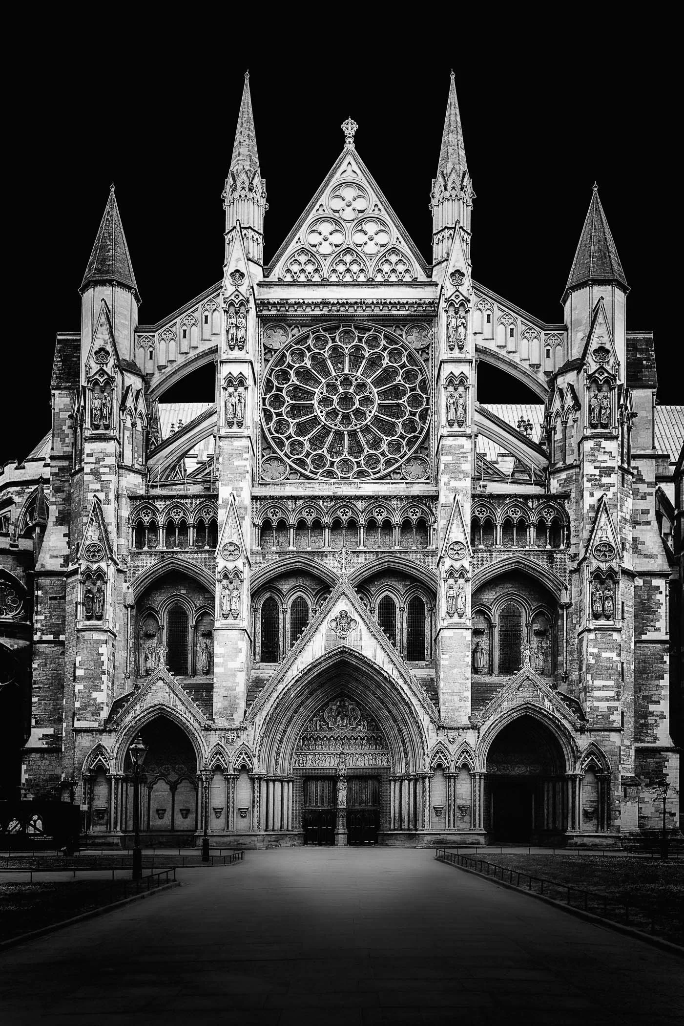 Westminster Abbey Facade A commanding view of intricate Gothic architecture, deep shadows, and timeless detail.