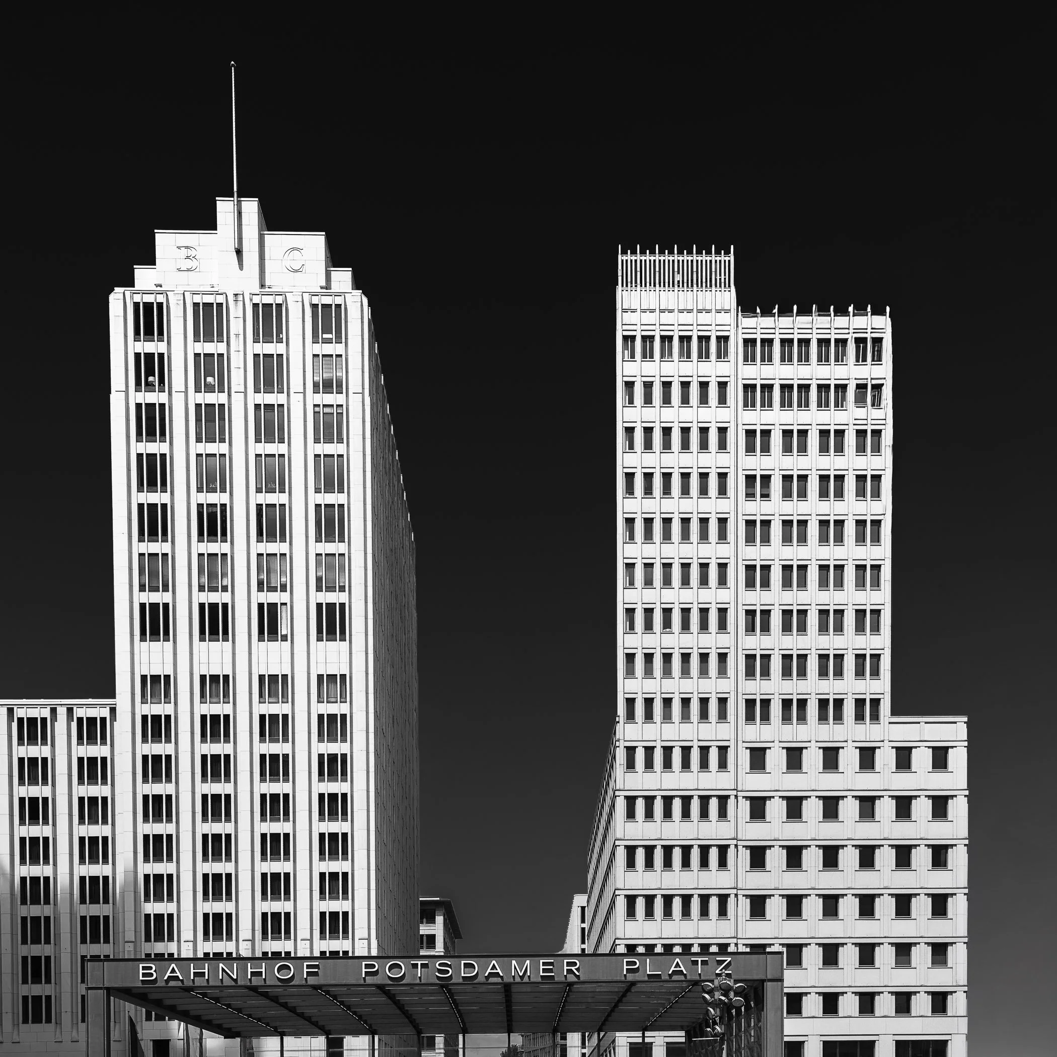 Potsdamer Platz A sharp, high-contrast look at the sleek modern architecture and dynamic urban geometry of Berlin's famous square.