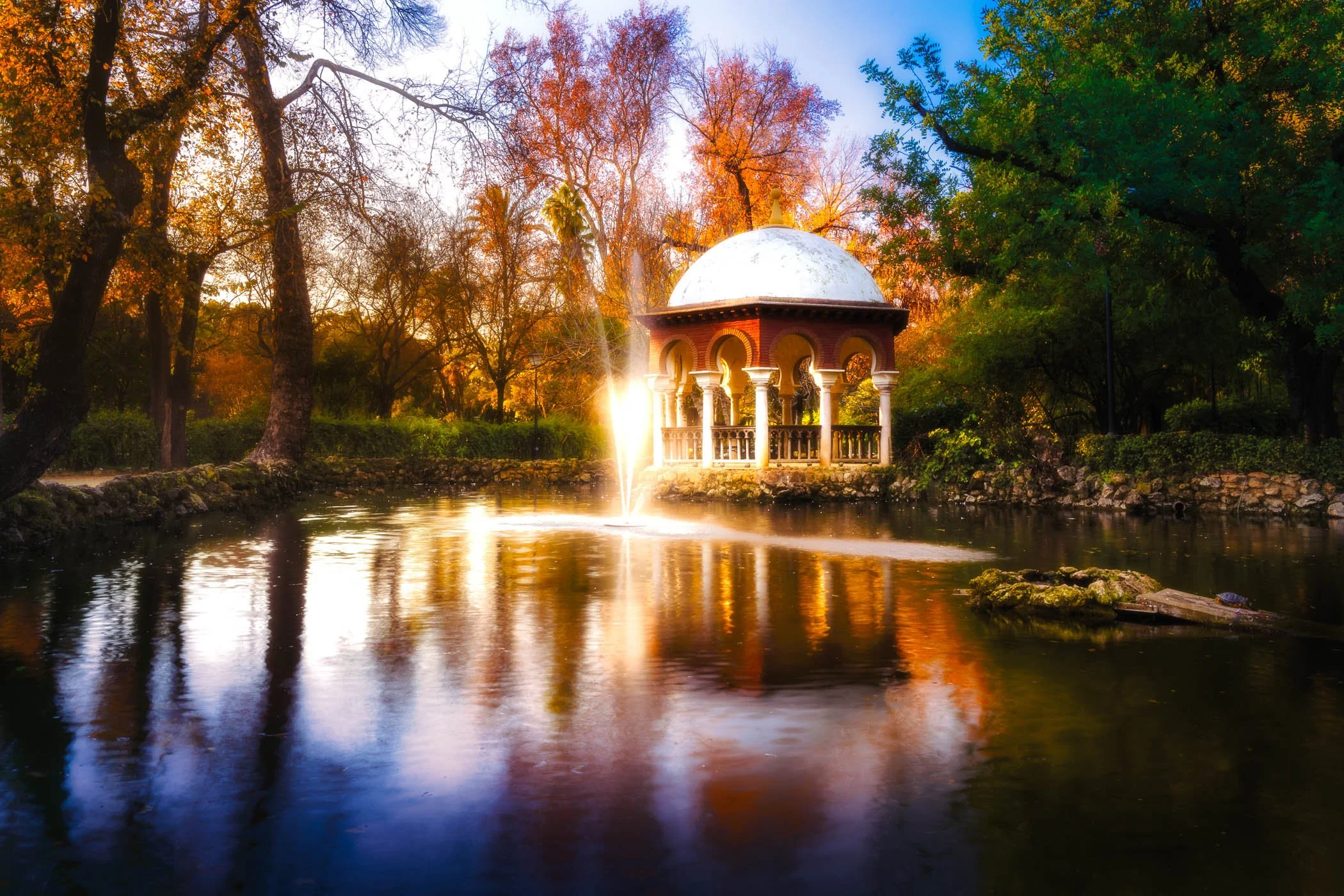 Serenity at the Gazebo A quiet, peaceful moment featuring a classic garden pavilion tucked inside Maria Luisa Park.