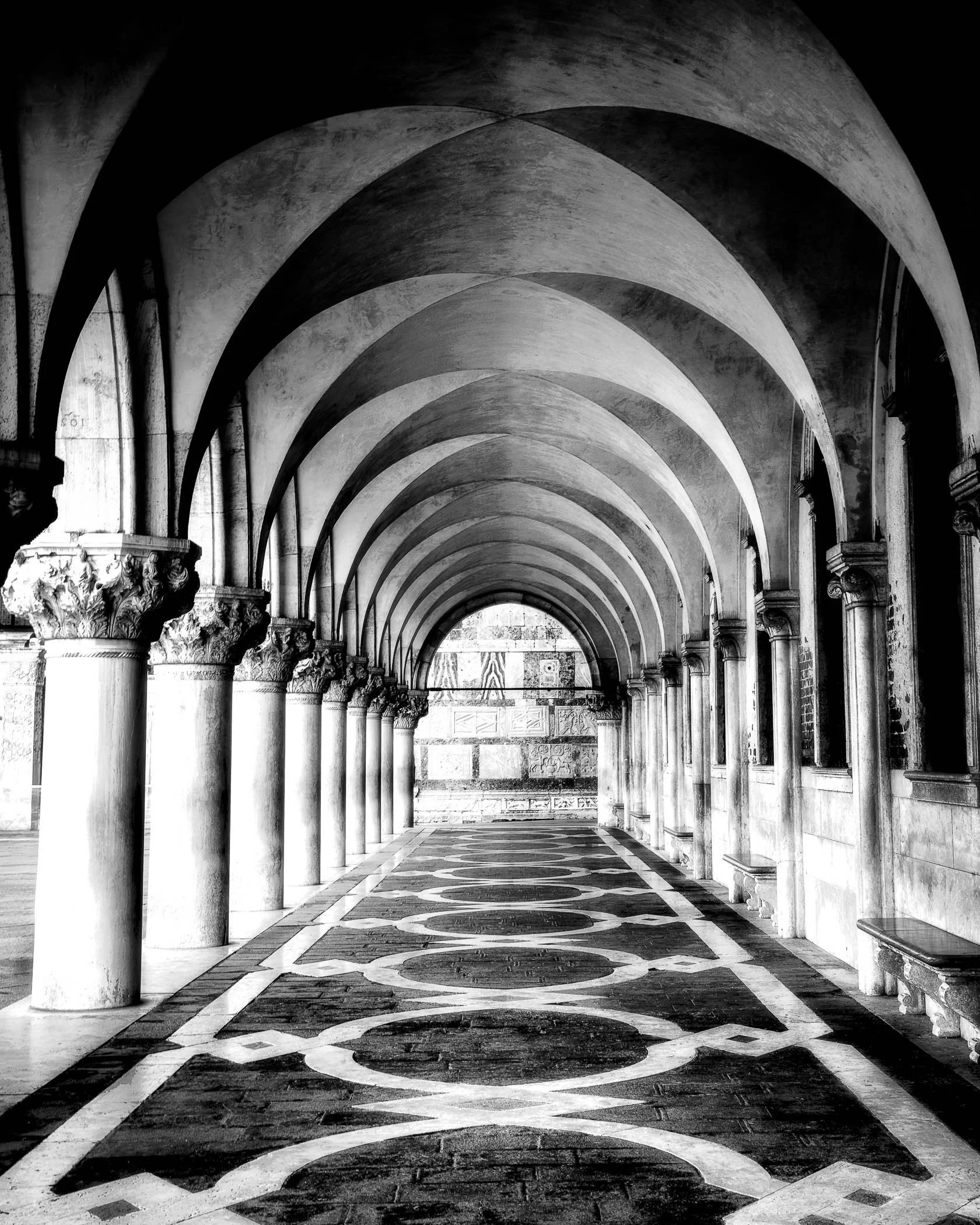 San Marco Colonnade A timeless capture of classical arches and sweeping light playing through the historic colonnade in Venice.