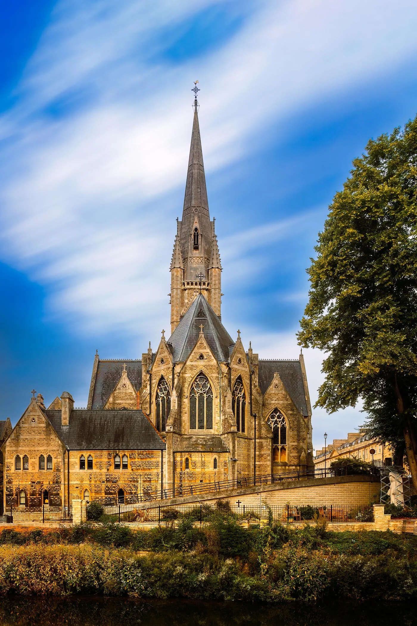 Saint Johns Church An architectural portrait showing the exterior spire and stonework of St John the Evangelist Roman Catholic Church.