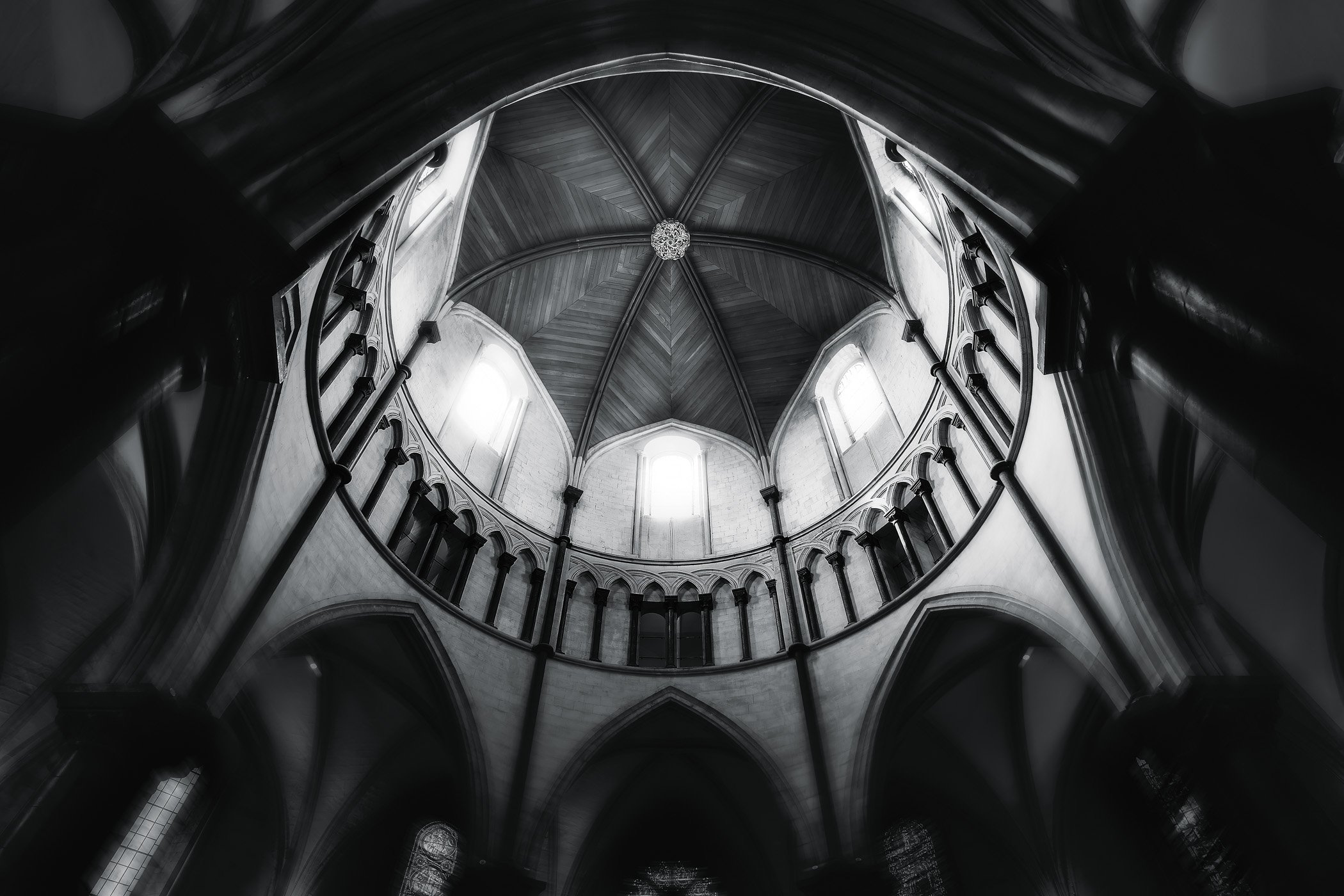 The Temple Framing shadow, symmetry, and historical grandeur in a rich black-and-white architectural portrait.