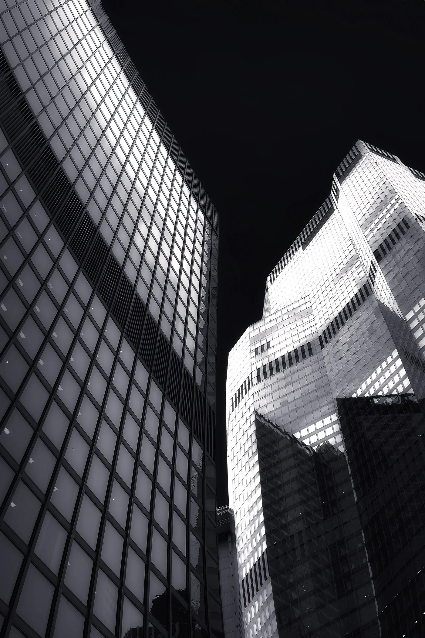 Light and Texture An abstract fine art detail focusing on the contrasting surfaces, metallic textures, and play of light on modern London structures.