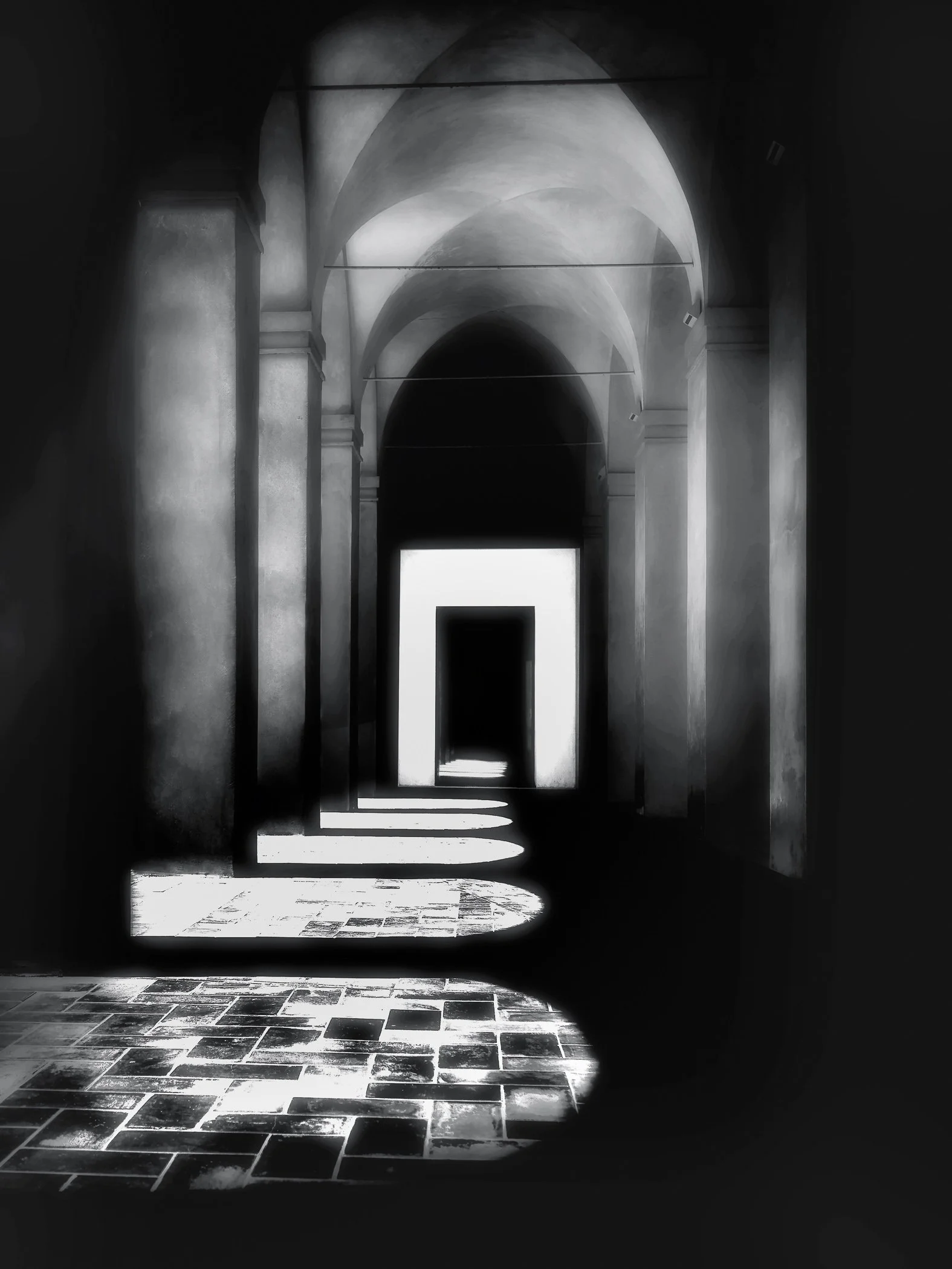 Sunlit Passage Sunlight and deep shadows beneath the arches of the Real Alcázar in Seville