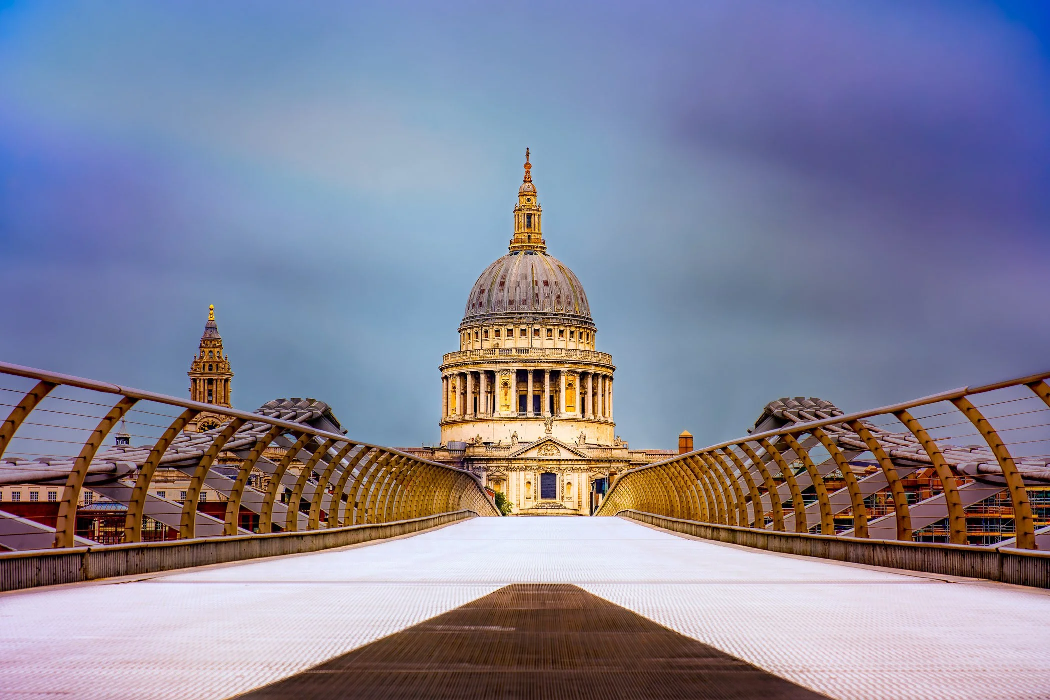 Saint Pauls Cathedral from the Millennium Bridge A classic perspective looking down the Millennium Bridge toward the grand dome of St Paul's Cathedral.