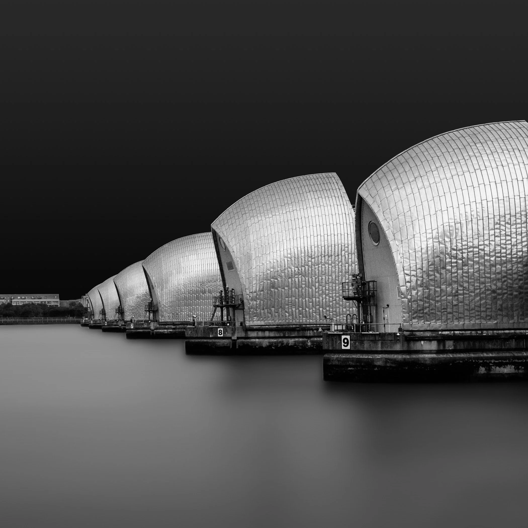 Guardians of the Thames Bold riverside structures standing resolute along the water, framing London's modern urban edge.