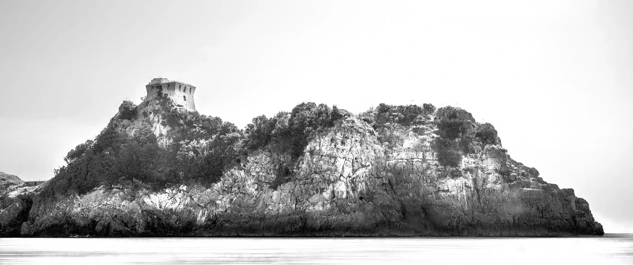House on a Rock A striking composition featuring a solitary coastal building perched dramatically atop a rocky outcrop by the sea.