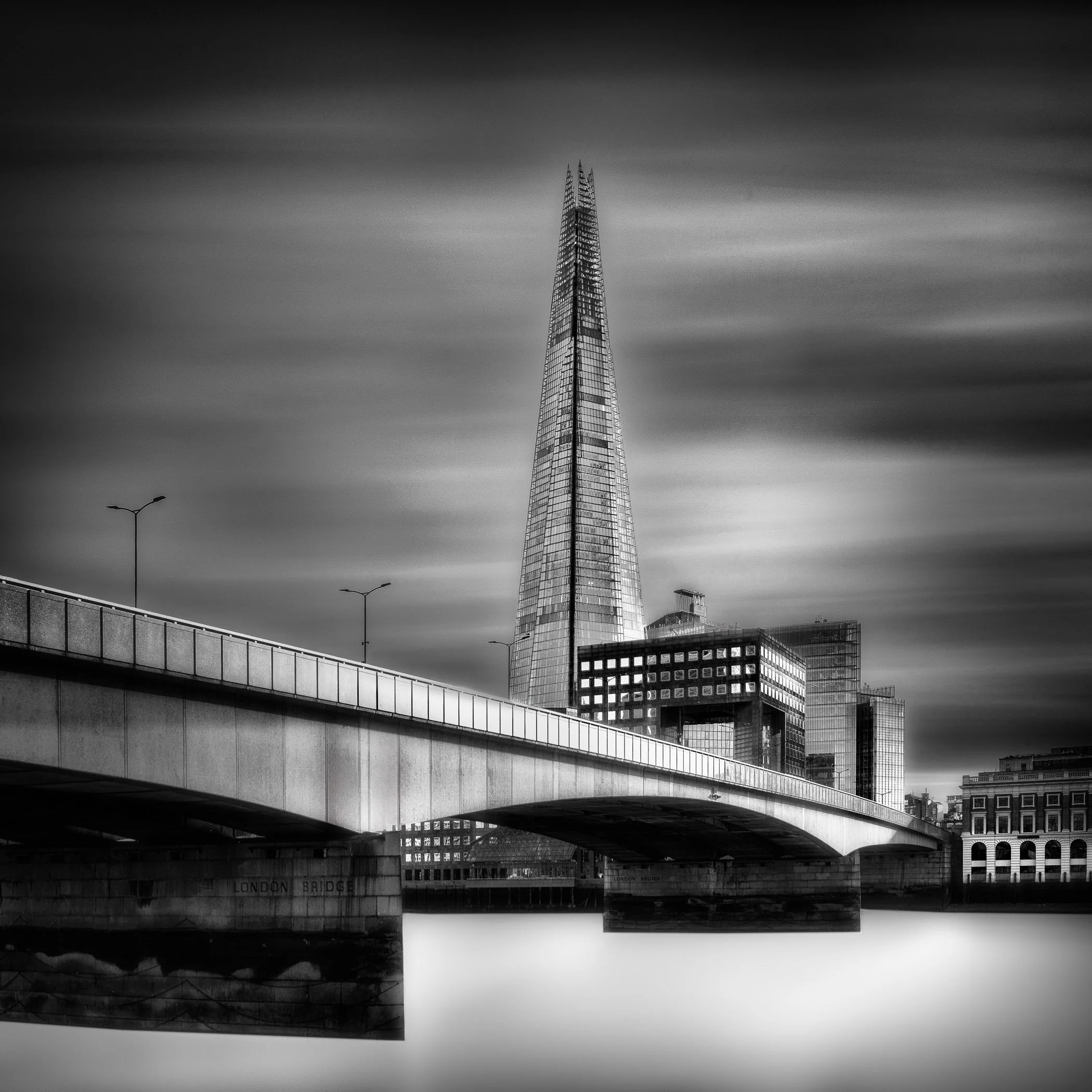 A scene from London of a bridge and the Shard
