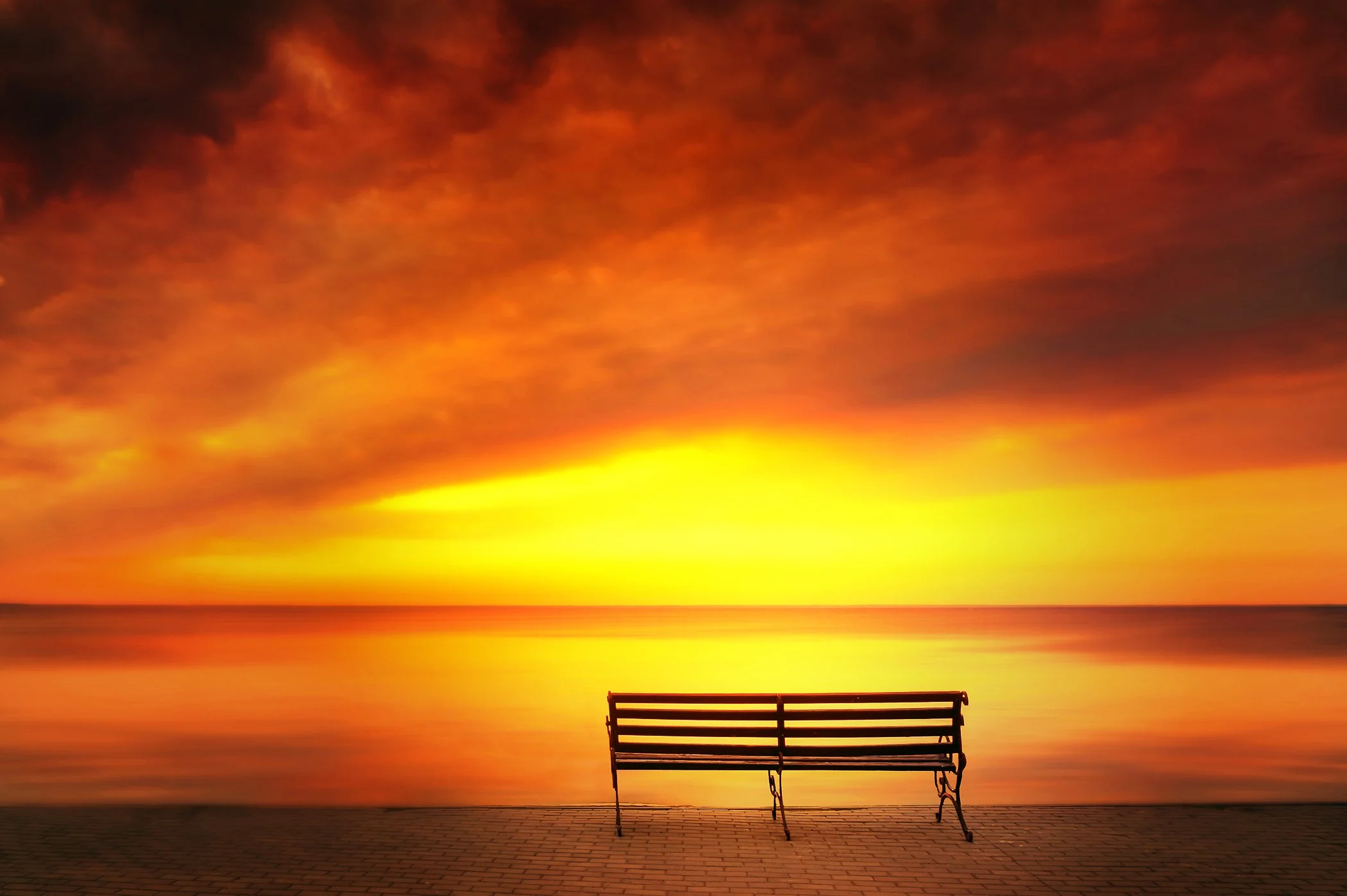 Golden Serenity A rich golden-hour composition bathing the water and shoreline in deep, warm ambient light.