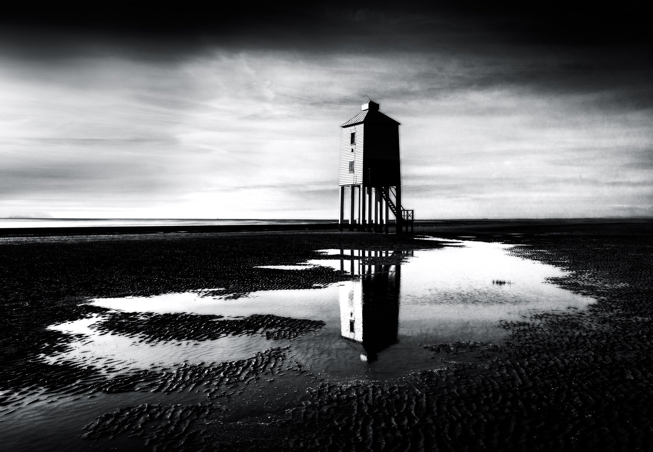 Lighthouse at Burnham on Sea A classic portrait showcasing the historic wooden lighthouse against a calm seascape.