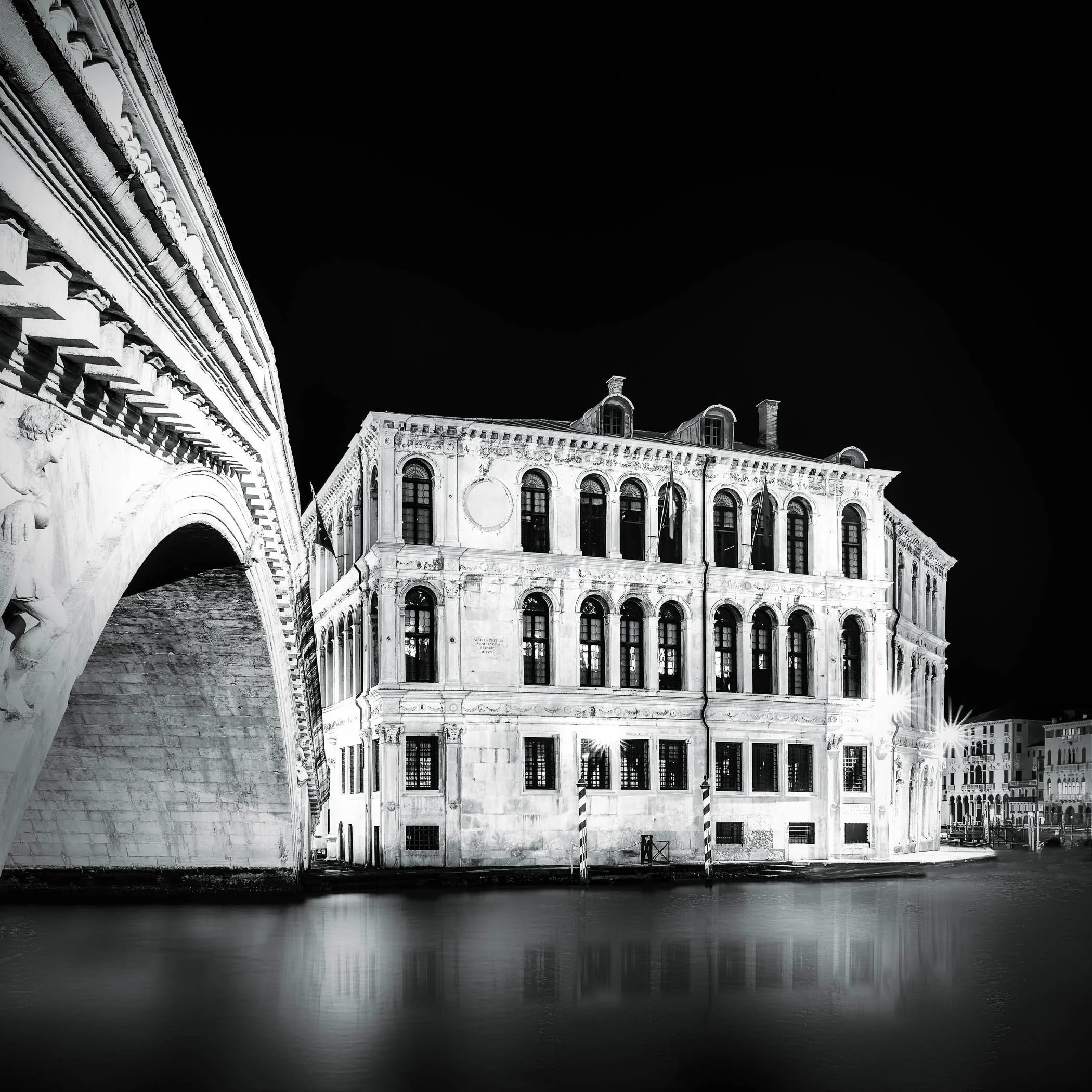 Beneath the Rialto Bridge Rialto Bridge in Venice photographed from water level beneath its stone arch.