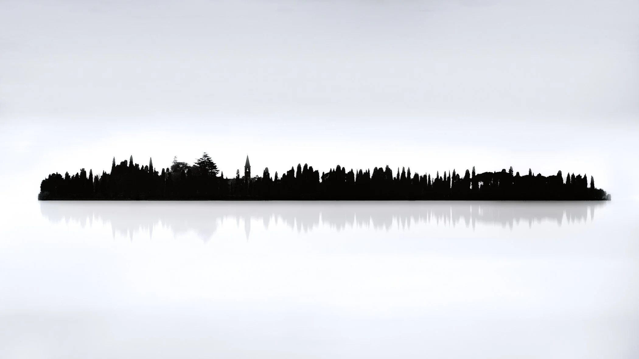 The Island of Silence A tranquil landscape where a dark tree line and building reflection float effortlessly in calm white waters.