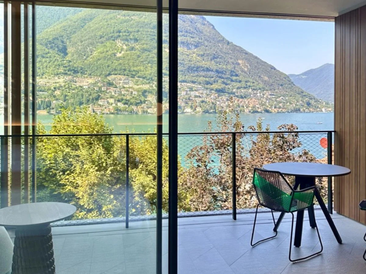 Balcony view from Il Sereno hotel overlooking Lake Como and surrounding mountains