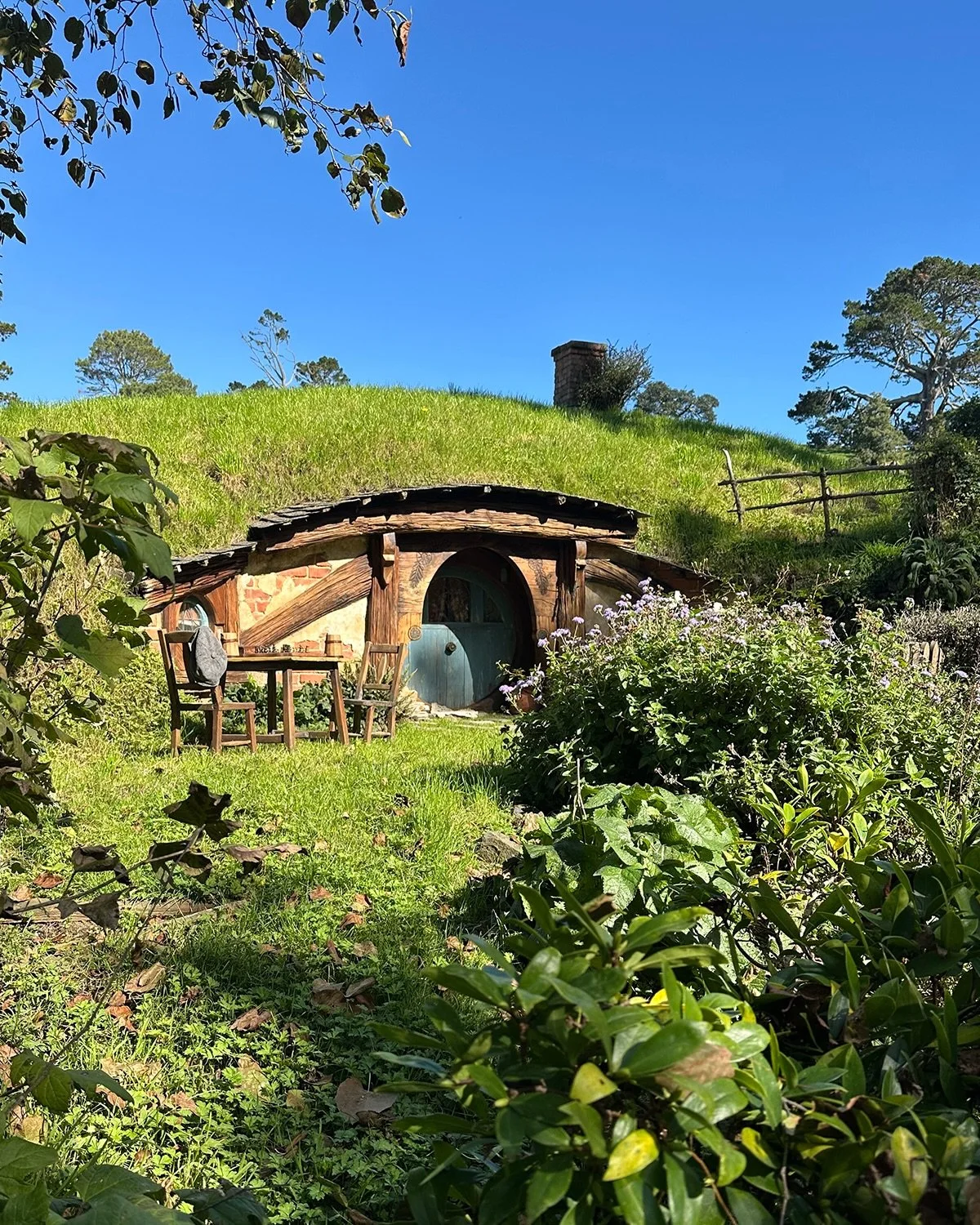 A sun-bathed corner of the Hobbiton Movie Set, where the rolling green hills of Matamata became the Shire.

One of New Zealand&rsquo;s most iconic landscapes, brought to life through film and imagination &mdash; and easily visited alongside a stay at